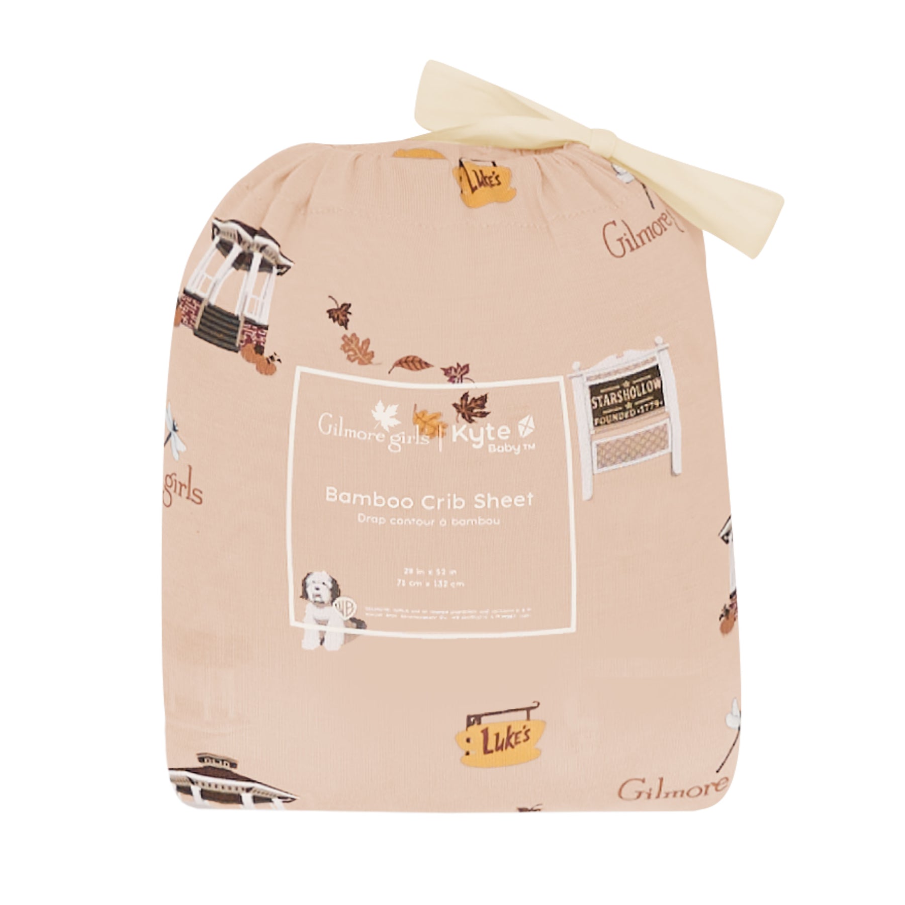 Beige bamboo crib sheet packaging with cartoon characters and text on a white background