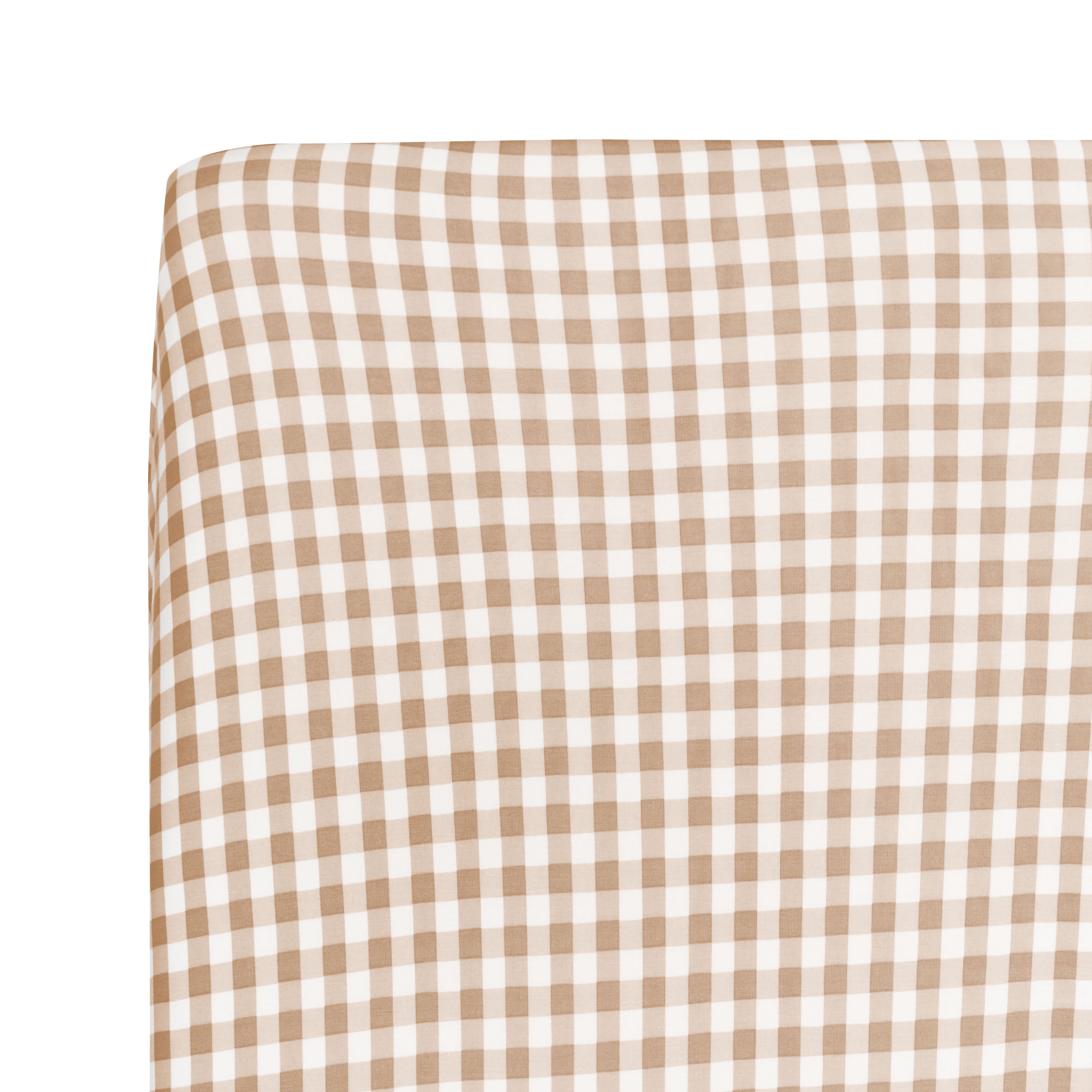 Close up of a corner on the Twin Sheet in Gingham Bisque shown on a mattress