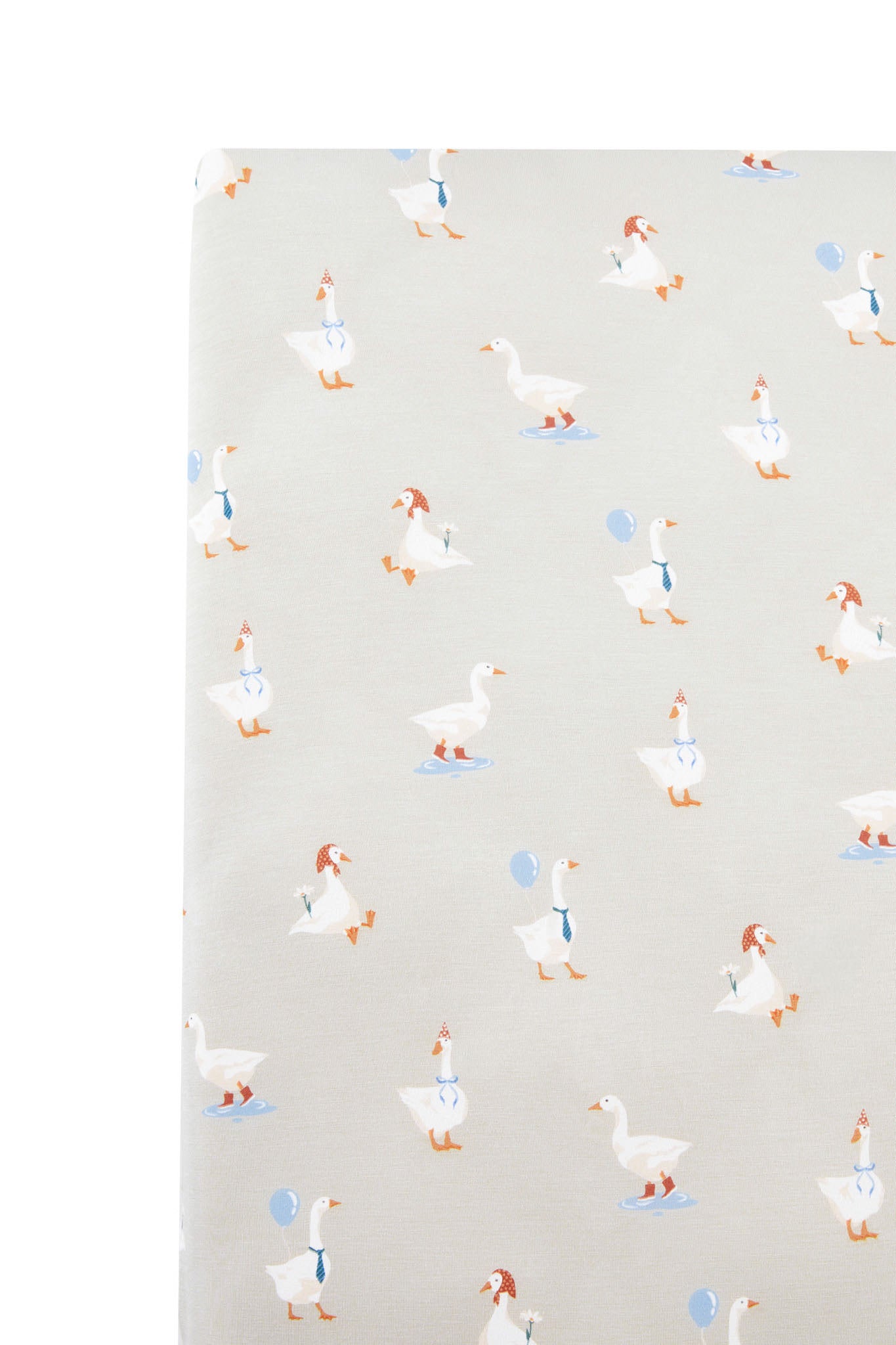 close up of Twin Sheet in Oat Silly Goose print on a white background