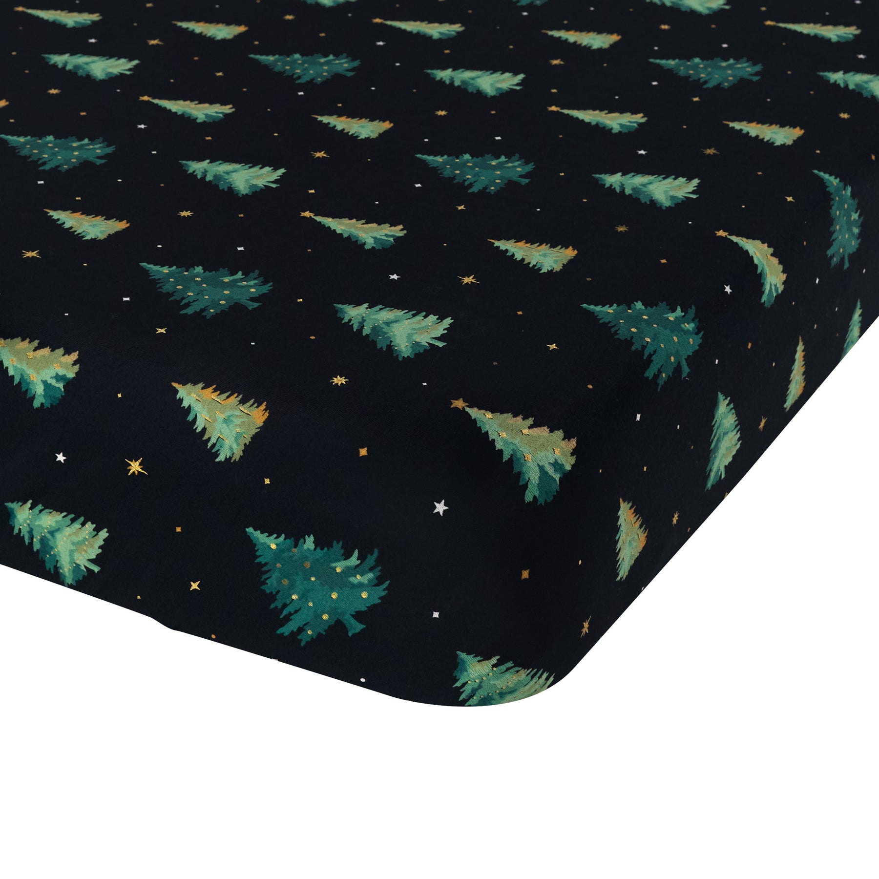 The corner of the Twin Sheet in Twinkle Tree shown on a mattress