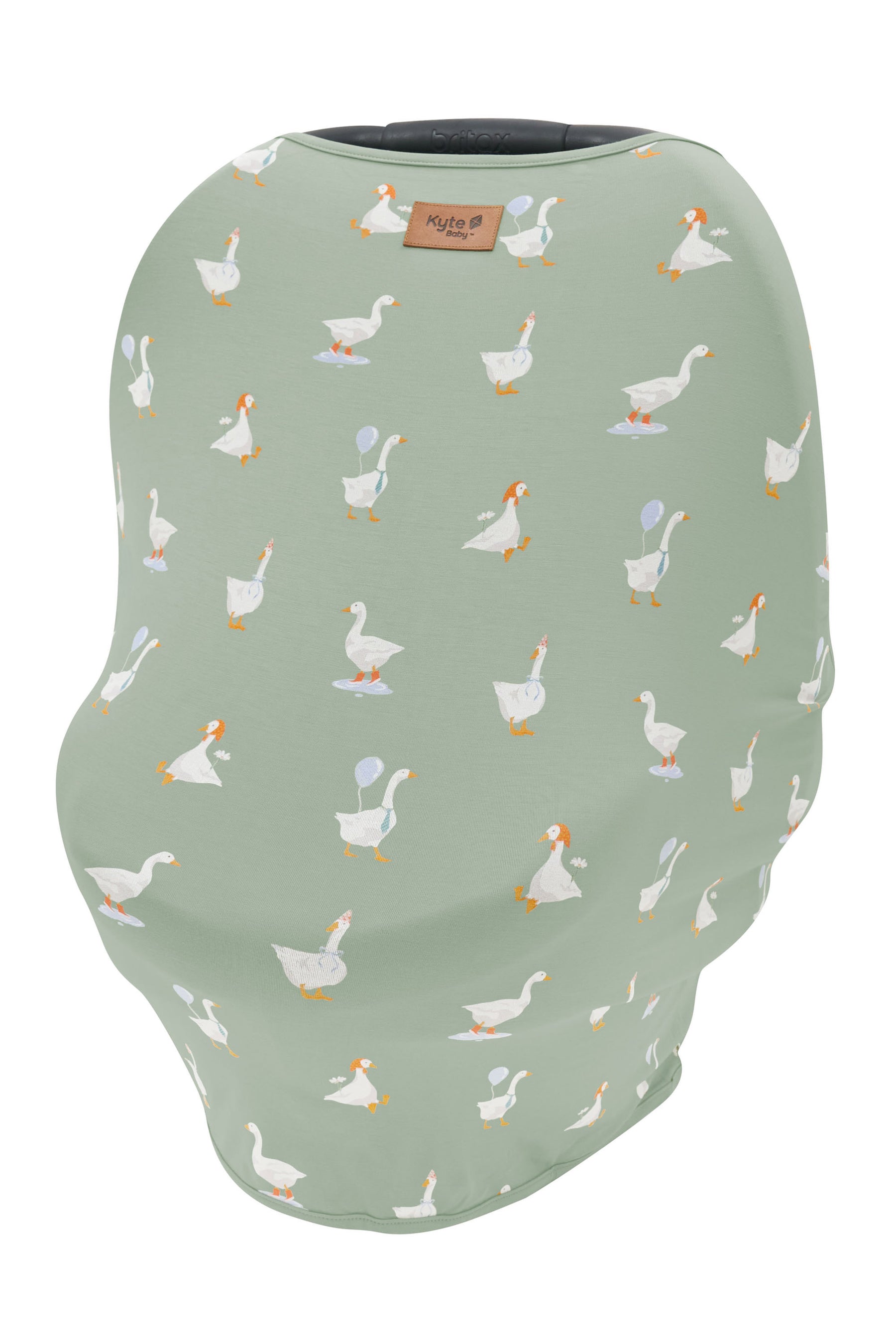 Car Seat Cover in Silly Goose shown overtop a car seat with the Kyte Baby Logo vegan leather tag visible