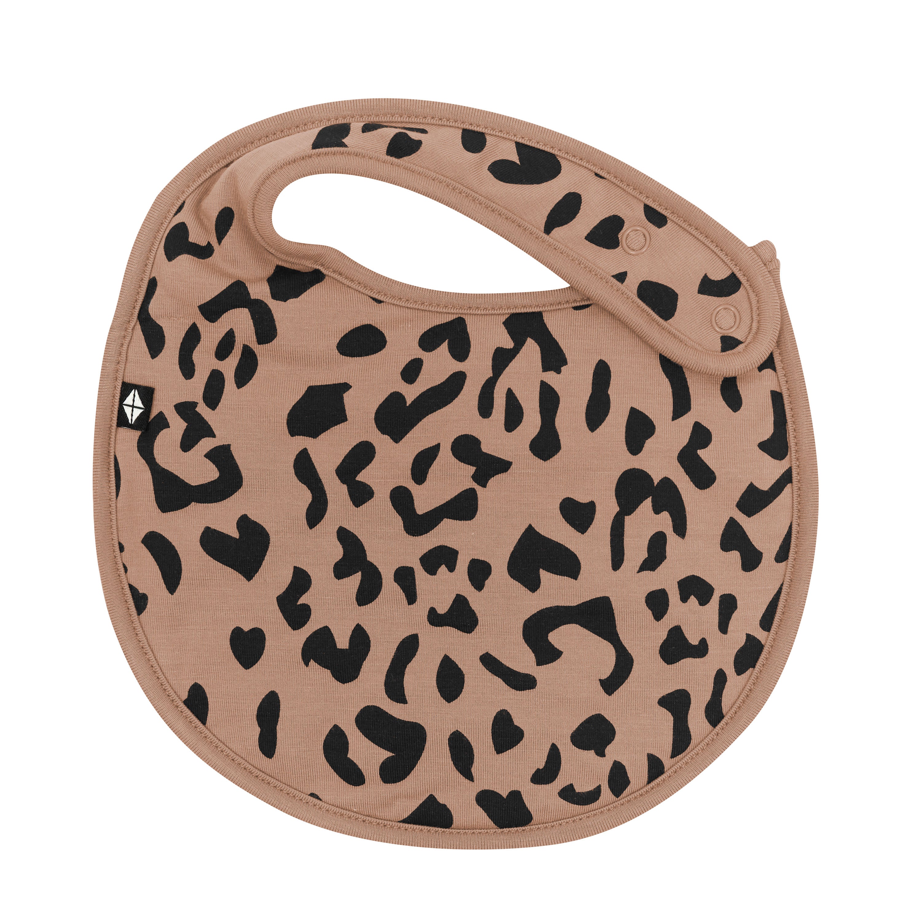 The front of the Cushy Bib in Latte Leopard showing the snap closure