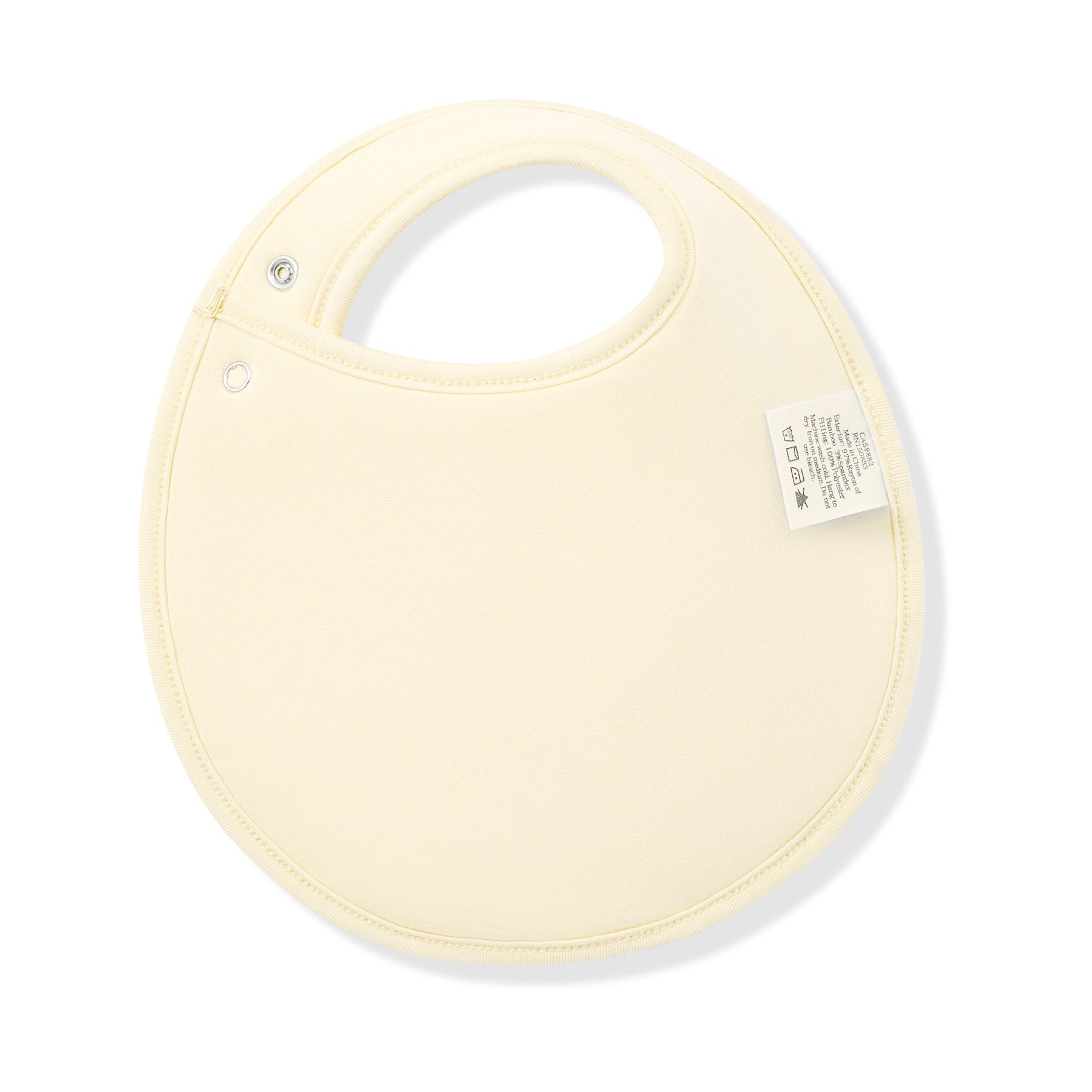 The back of the Cushy Bib in Gingham Chamomile showing the light yellow backing