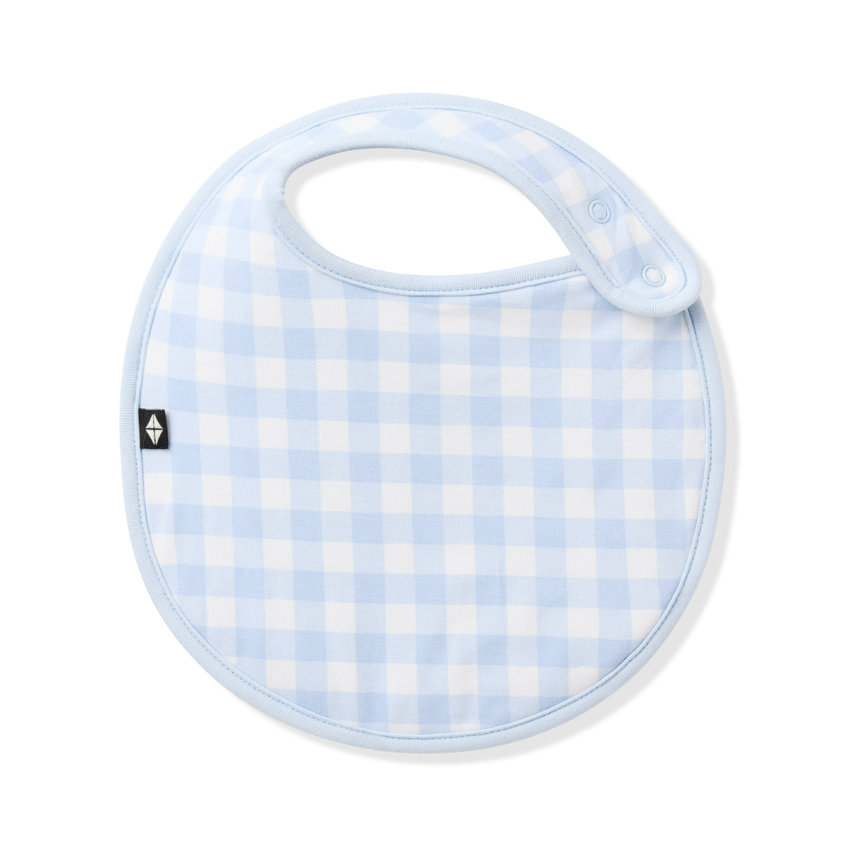 Front of the Cushy Bib in Gingham Breeze showing the snap closure
