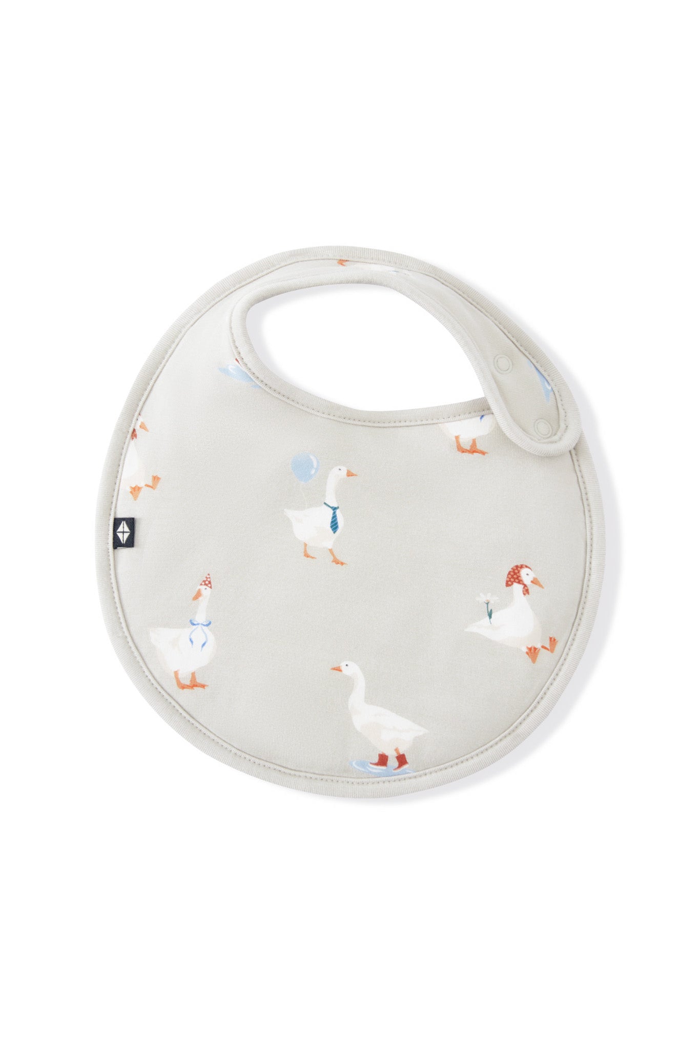 Cushy Bib in Oat Silly Goose print on a white background
