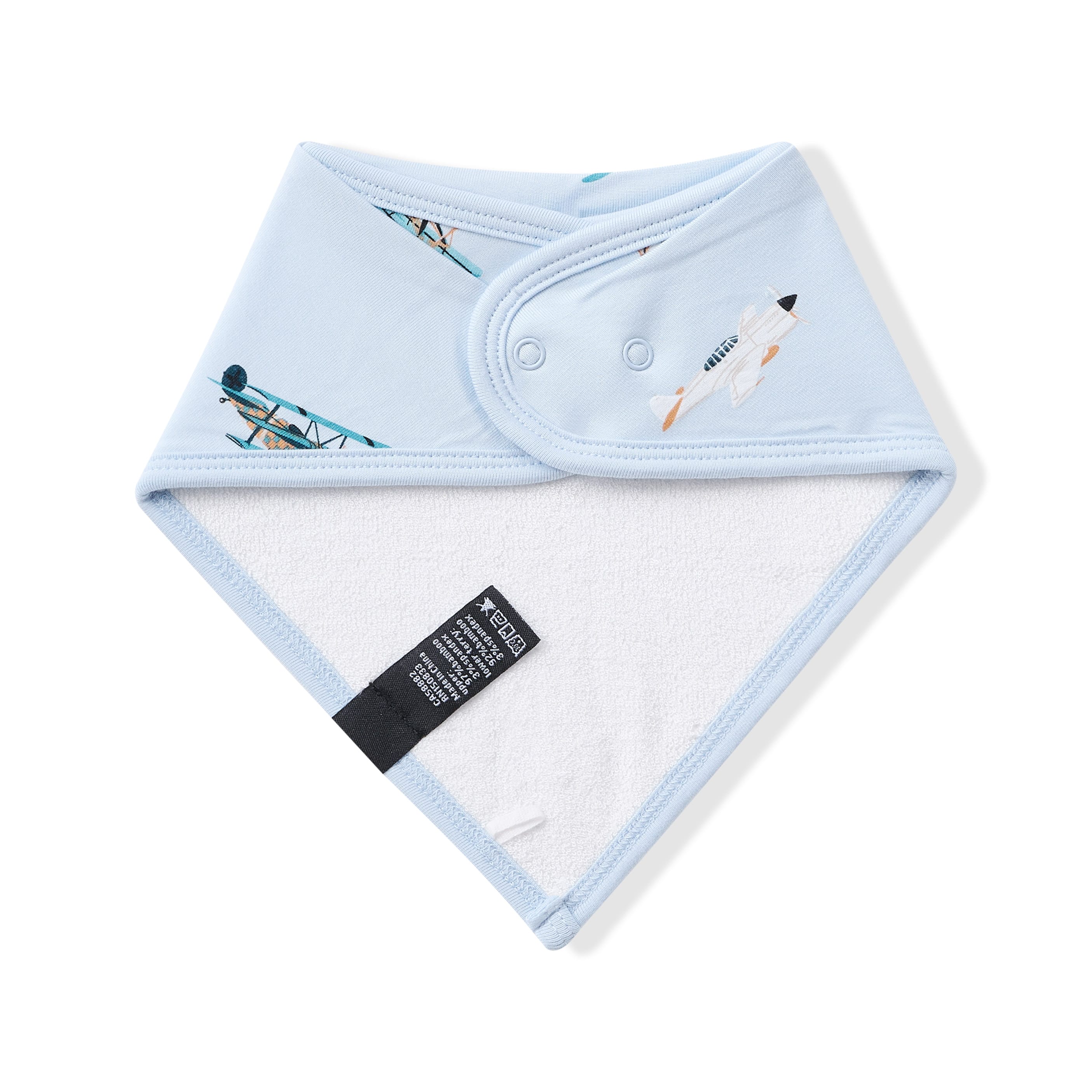 The back of the Bib in Take Off showing the snap closure and bamboo terry cloth backing