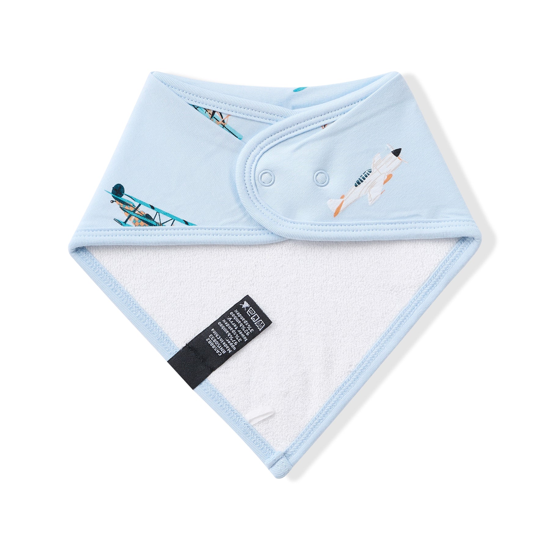 The back of the Bib in Take Off showing the snap closure and bamboo terry cloth backing