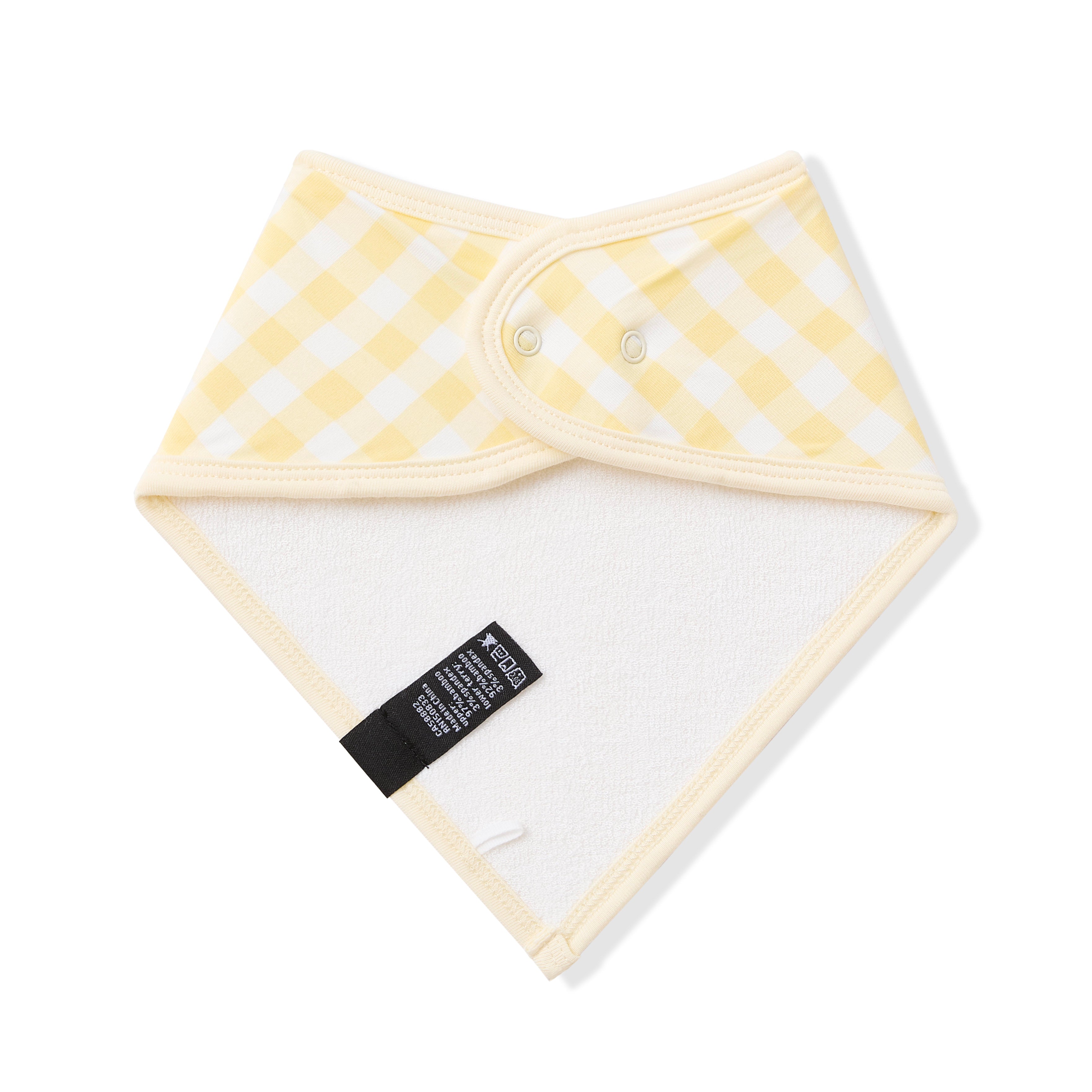 Back of the Bib in Gingham Chamomile showing the snap closure and bamboo terry cloth backing