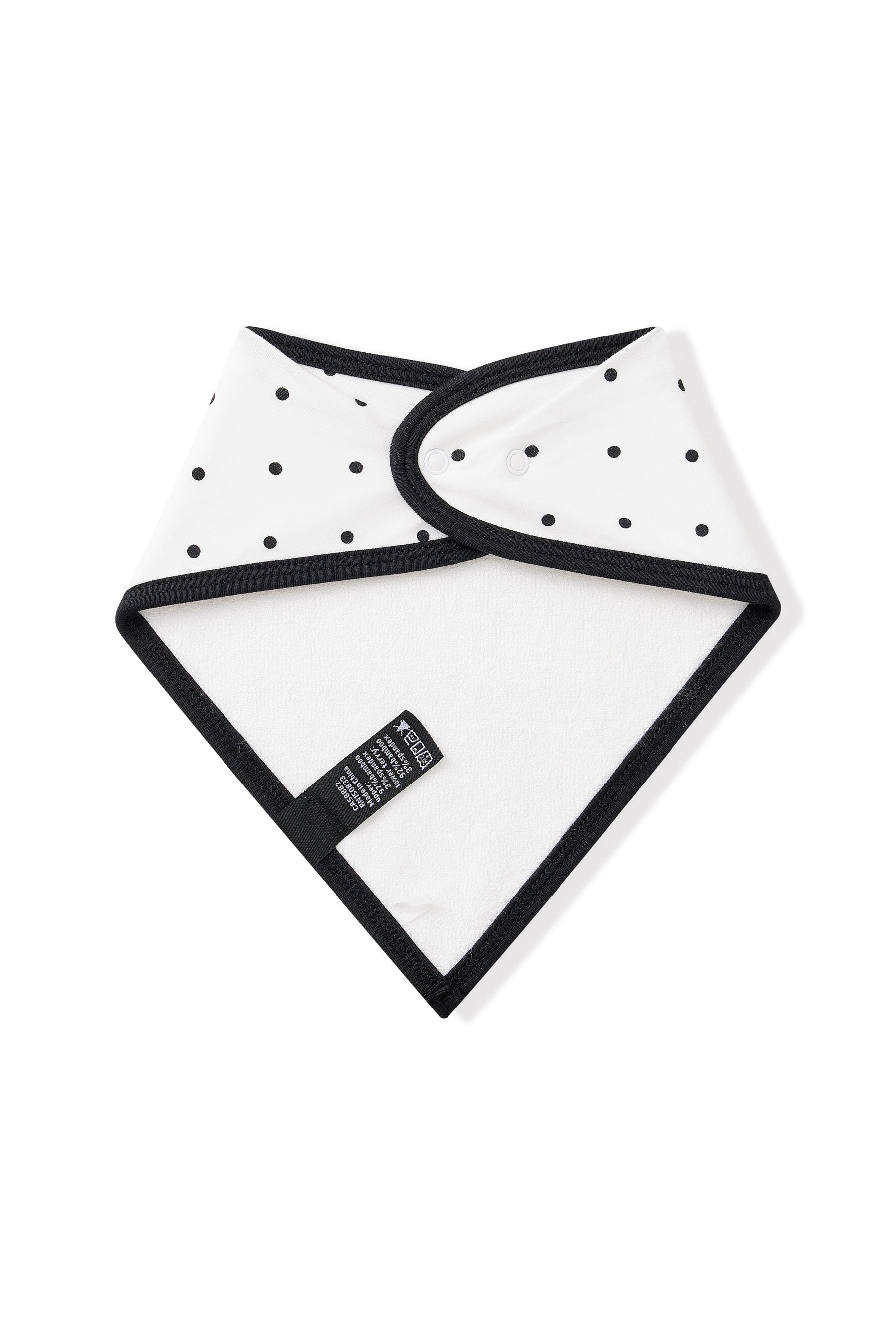Back side of Bib in Midnight Polka Dot with black trim on white background