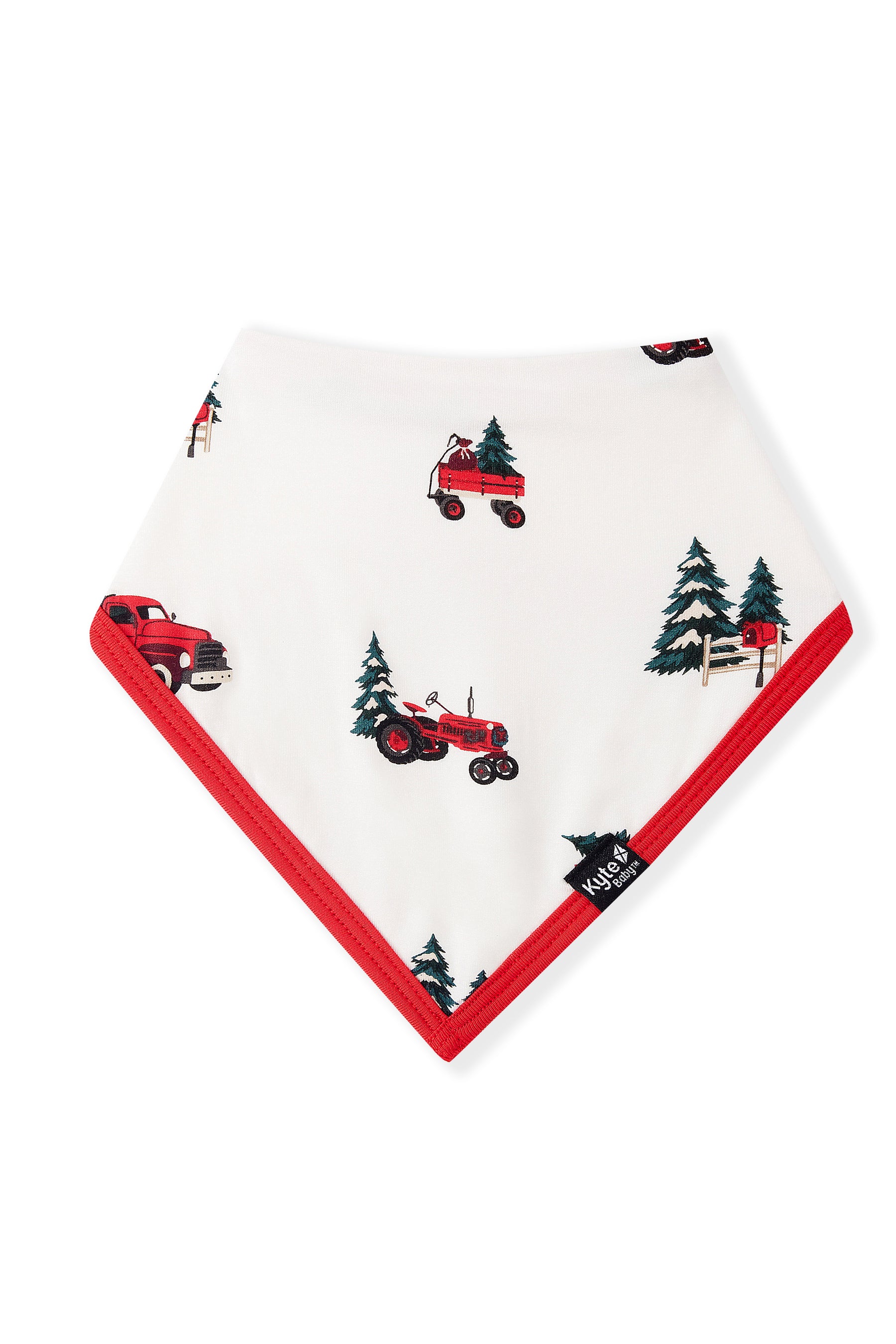 A white baby bandana bib with red trim, featuring a pattern of red tractors, vintage trucks, and green pine trees, shown on a plain white background.