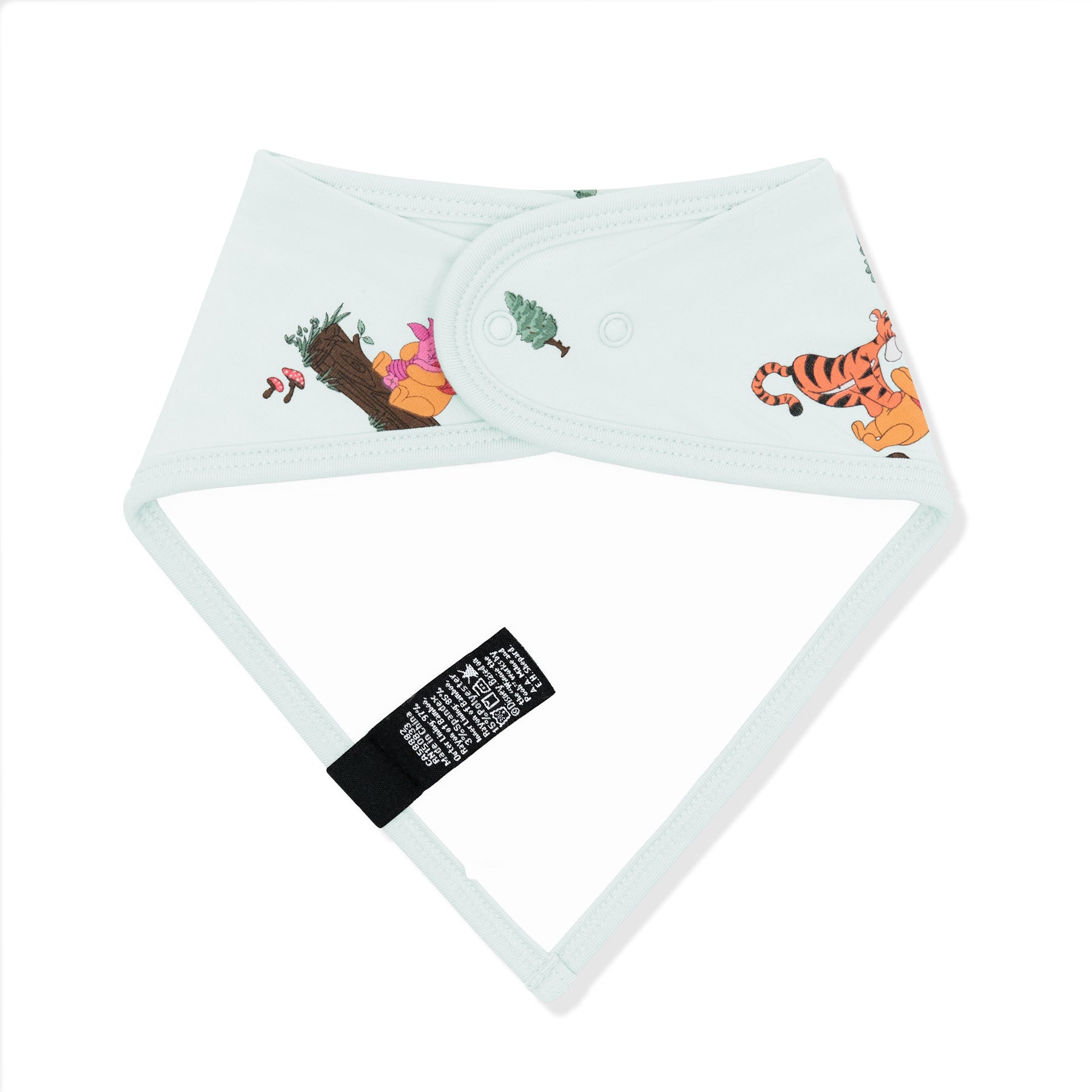 The back of the Bib in Winnie the Pooh Hundred Acre Wood showing the snap closure and bamboo terry cloth backing