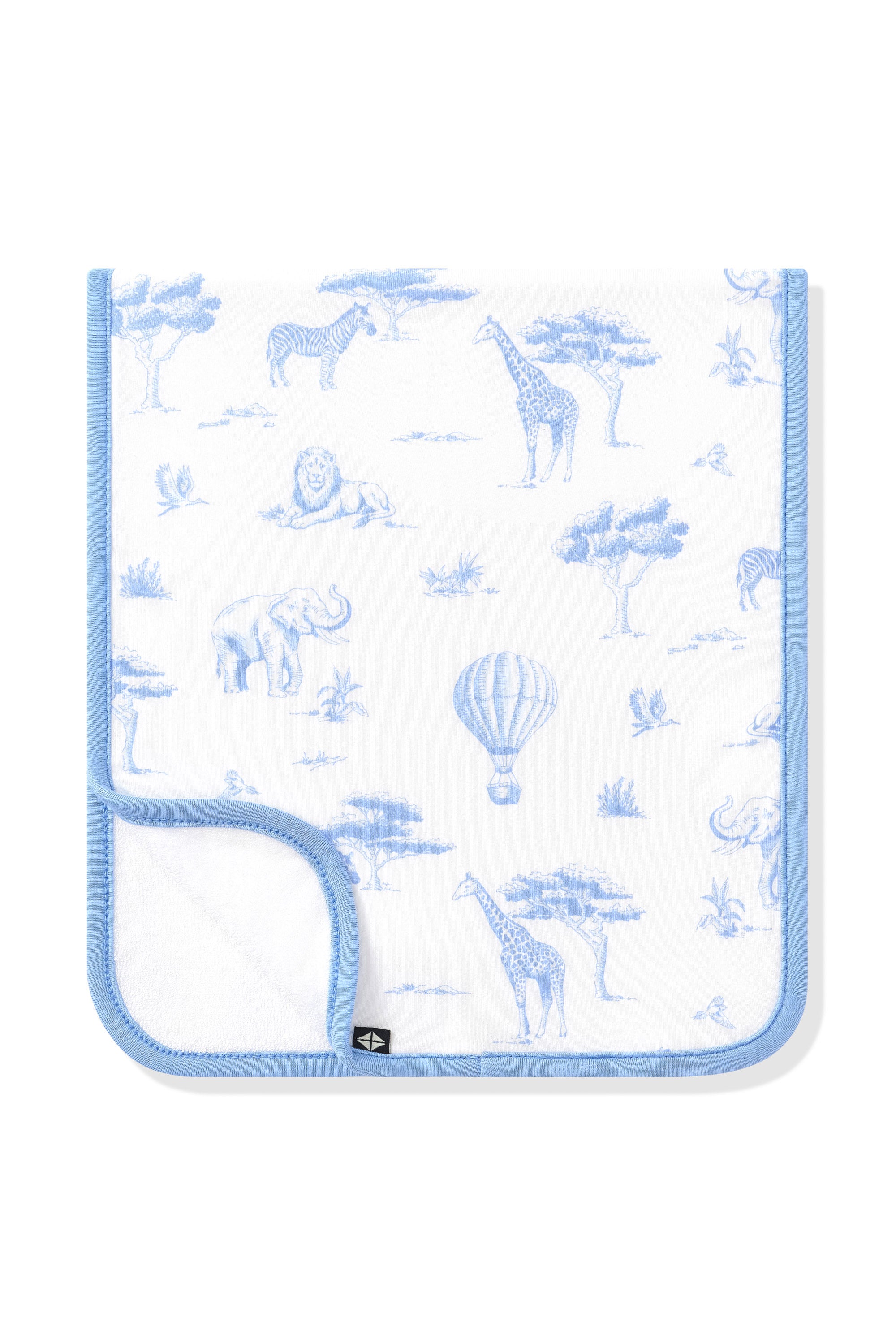 Burp Cloth in Toile Safari folded in half with the corner folded up