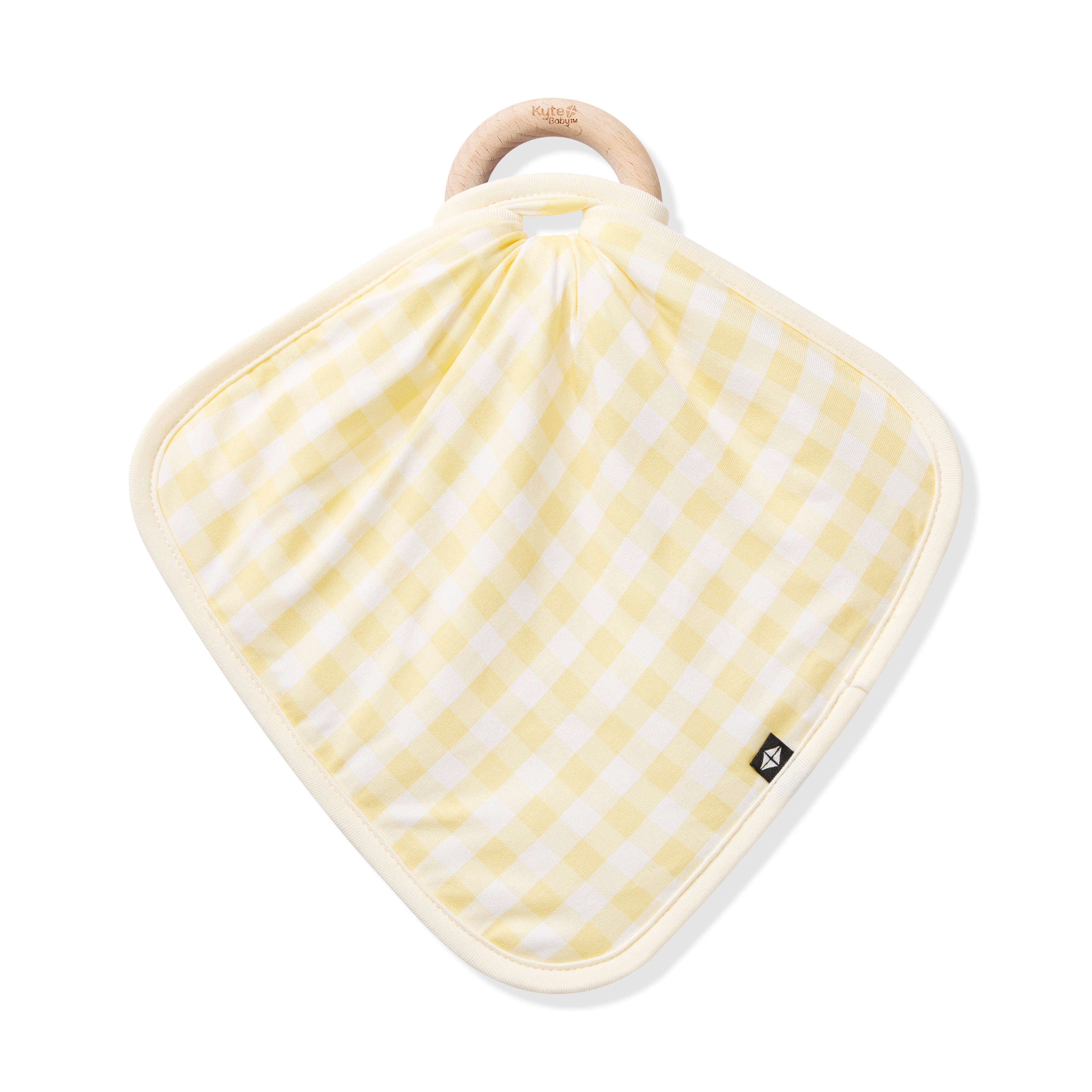 The front of the Lovey in Gingham Chamomile with Removable Wooden Teething Ring shown on a wooden ring