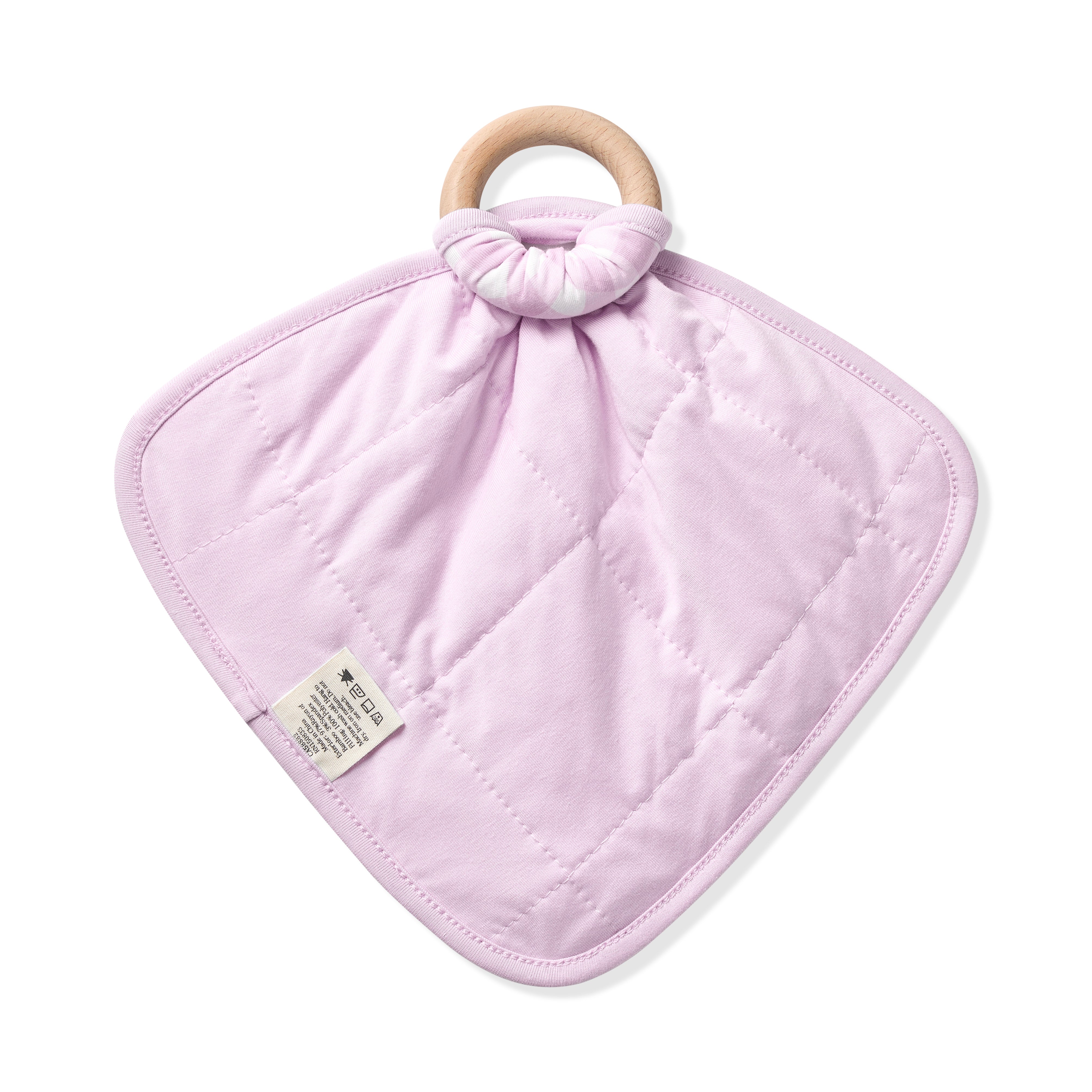 The quilted light purple backing of the Lovey in Gingham Thistle with Removable Wooden Teething Ring shown knotted to a wooden ring