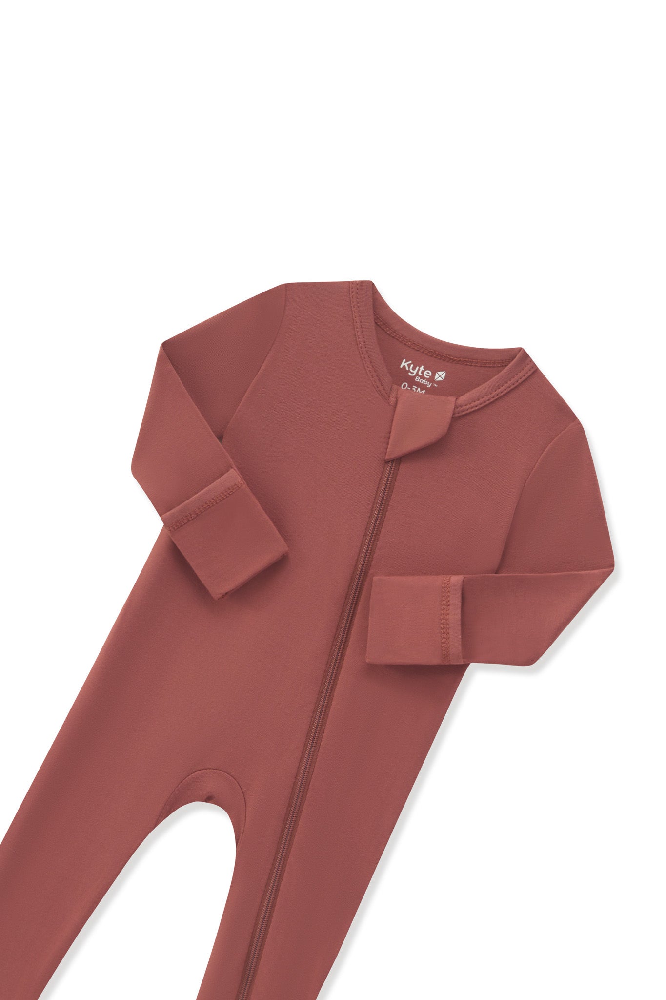 Close up of the zipper garage and fold over hand cuffs on the Zippered Romper in Ember on a white background