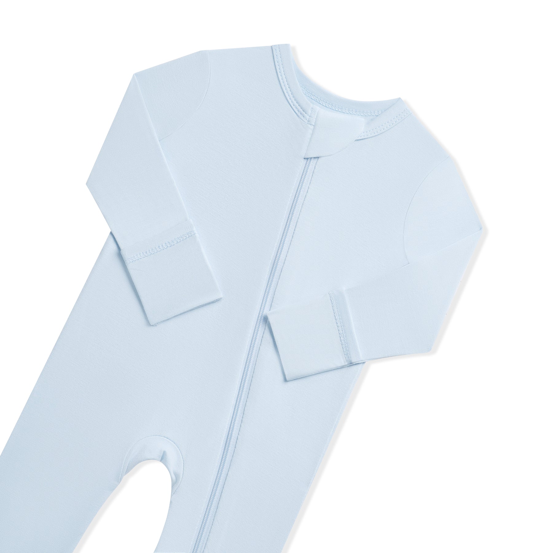 Close up of the zipper garage and fold over hand cuffs on the Zippered Romper in Breeze