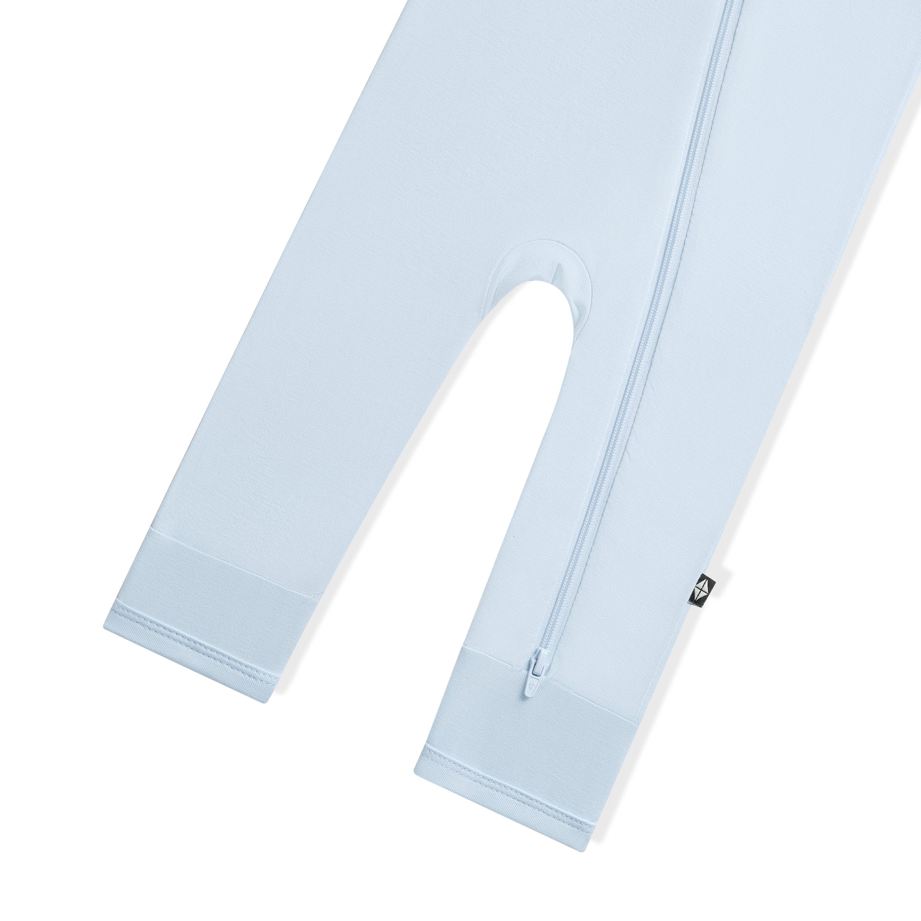 Zipper closure shown on the leg of the Zippered Romper in Breeze