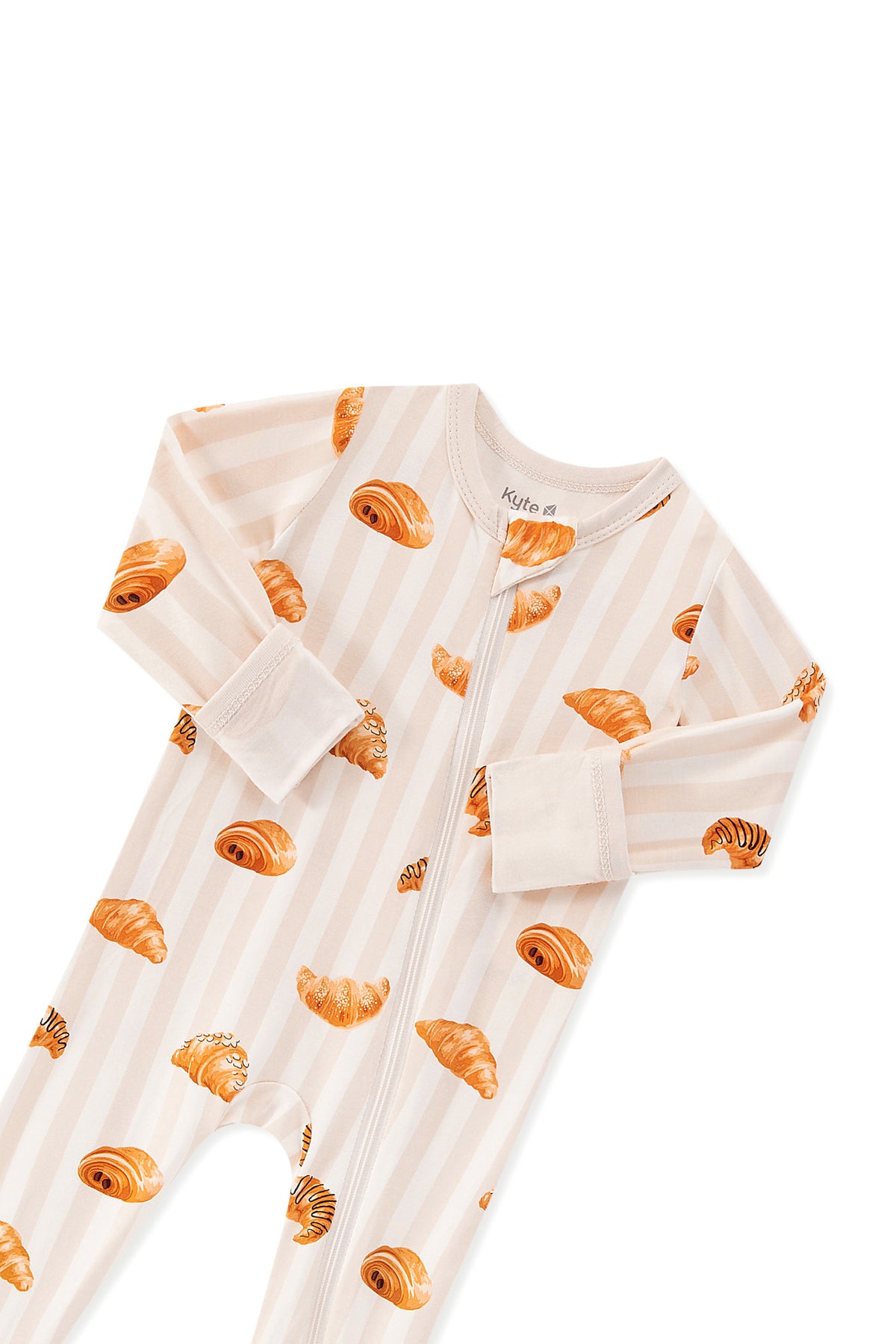Zippered Romper in Croissant print with zipper garage on a white background