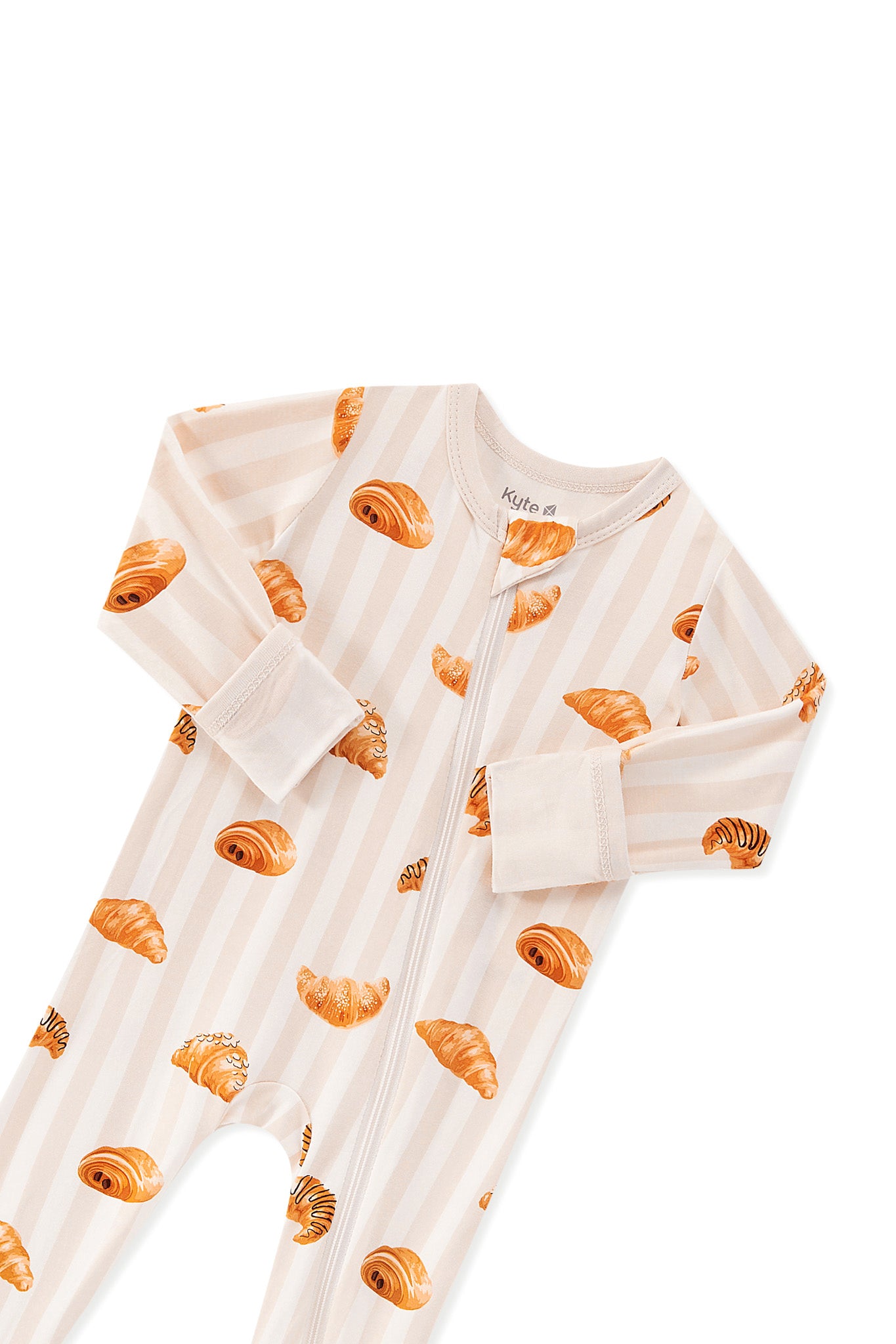 Zippered Romper in Croissant print with zipper garage on a white background