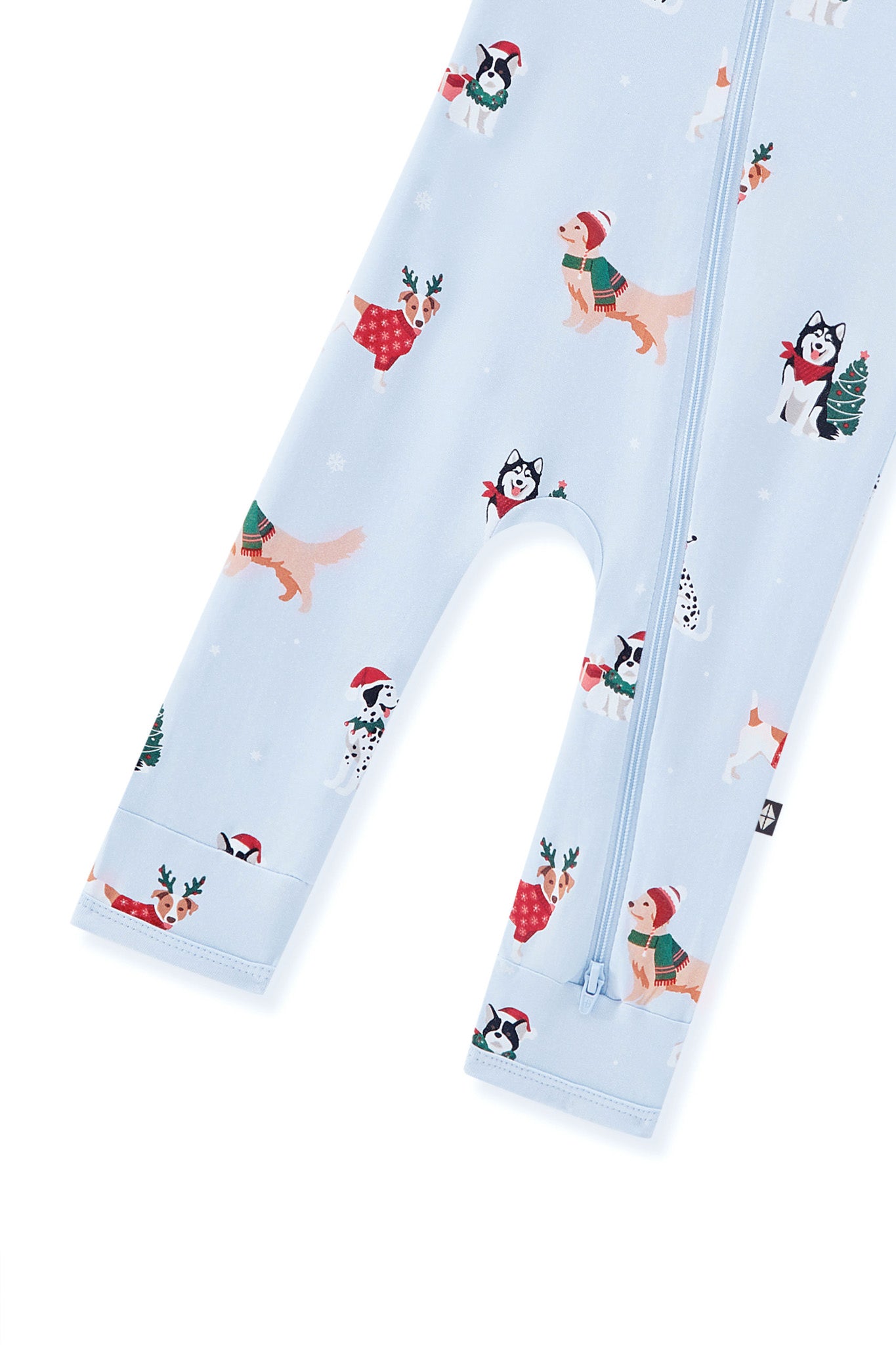Bottom part of Blue Zippered Romper in Holiday Pups print on a white background