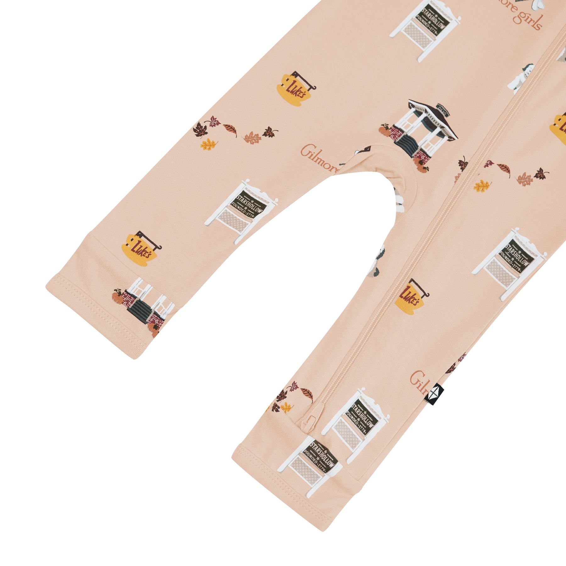 Beige romper with printed design of Gilmore Girls elements on a white background