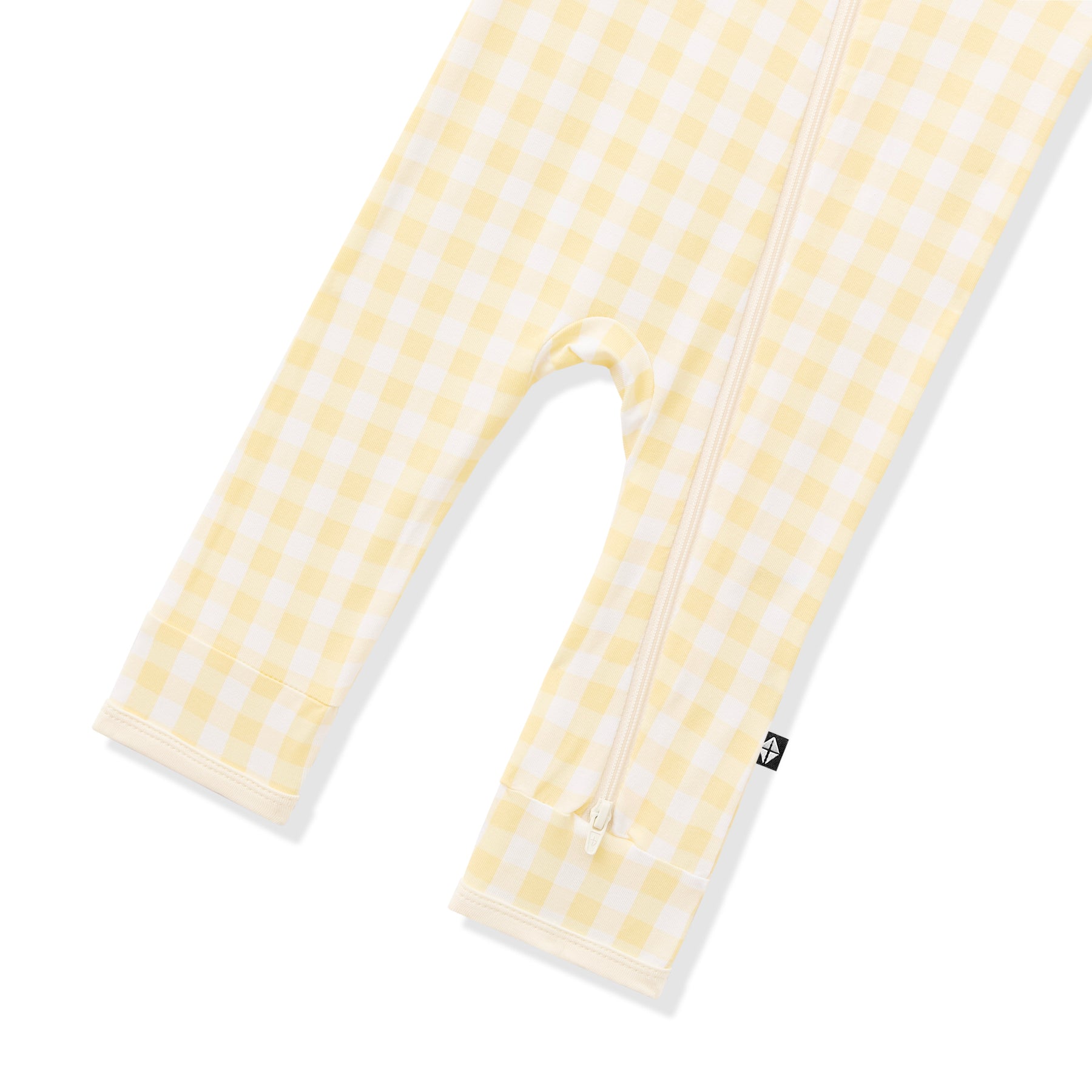 zipper closure shown on the leg of the Zippered Romper in Gingham Chamomile