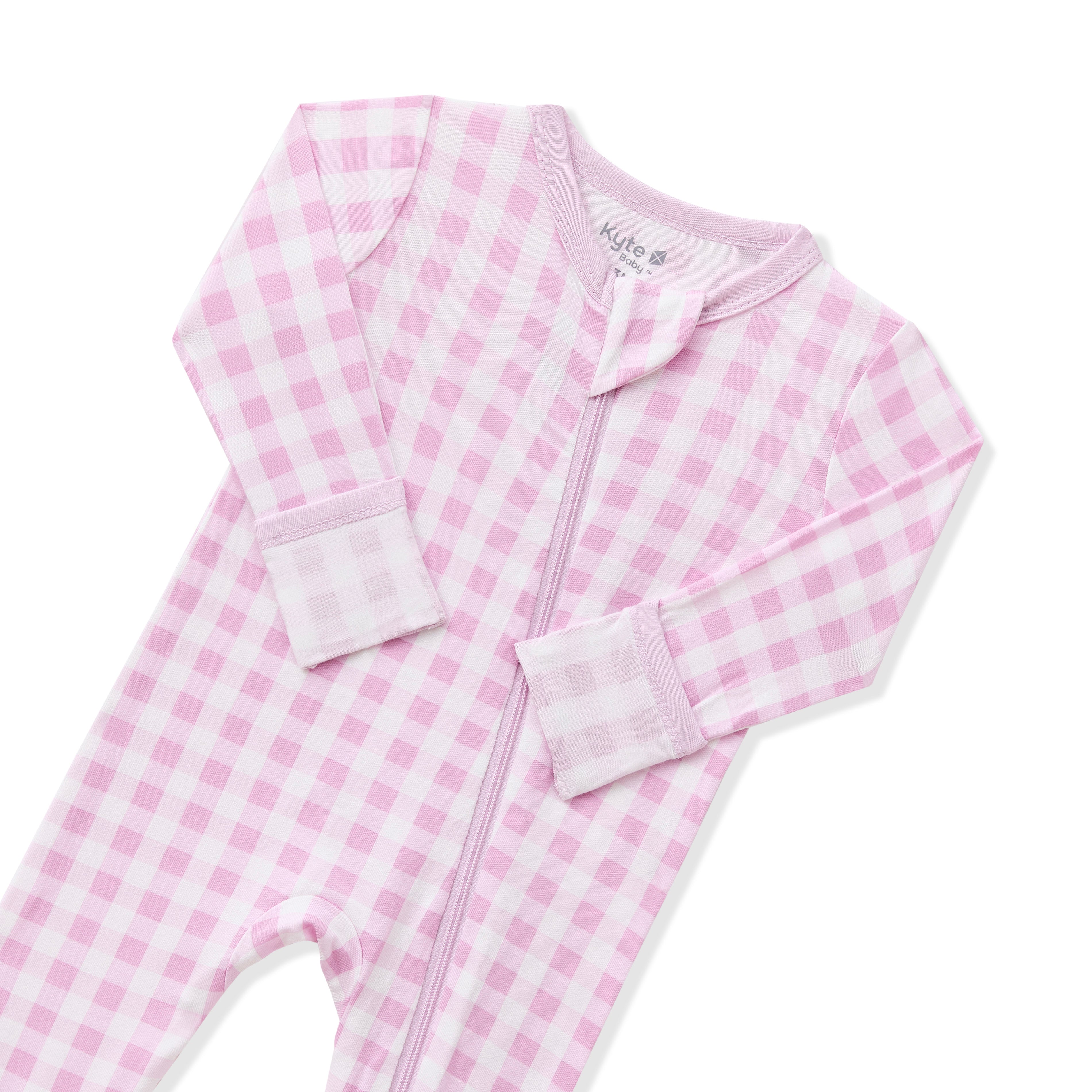 Close up of the zipper garage and fold over hand cuffs shown on the Zippered Romper in Gingham Thistle
