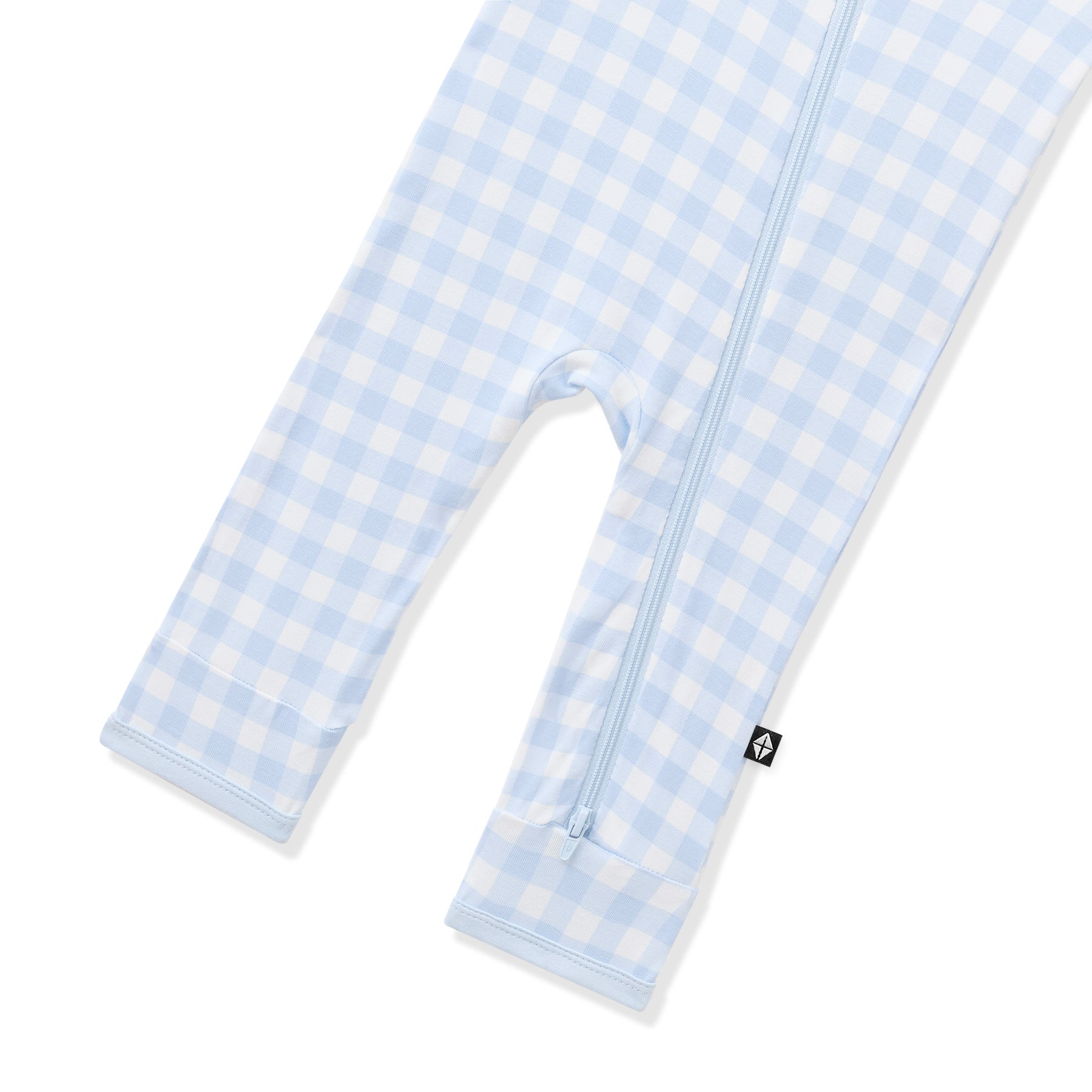 Close up of the zipper closure on the leg of the Zippered Romper in Gingham Breeze