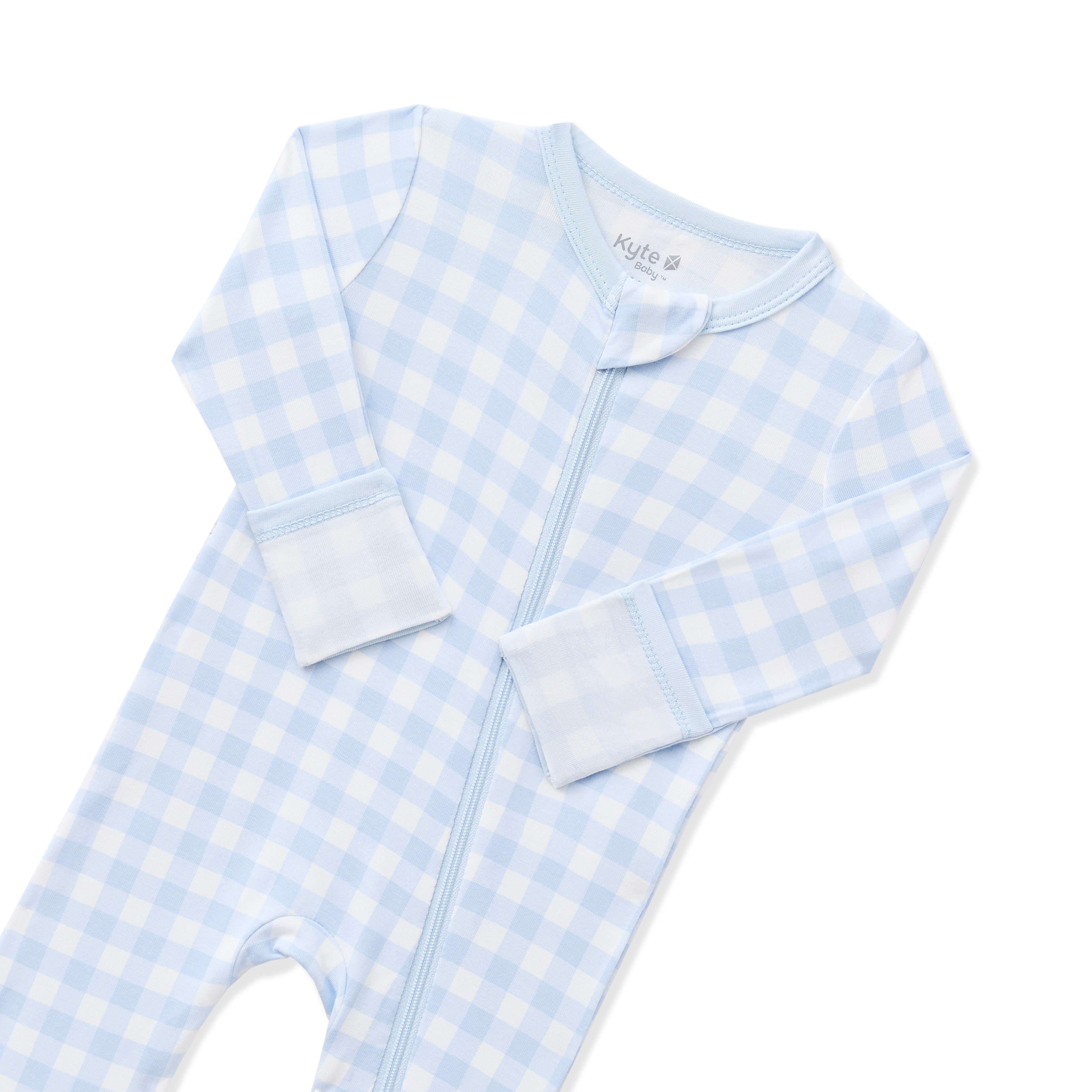 Close up of the zipper garage and fold over hand cuffs shown on the Zippered Romper in Gingham Breeze