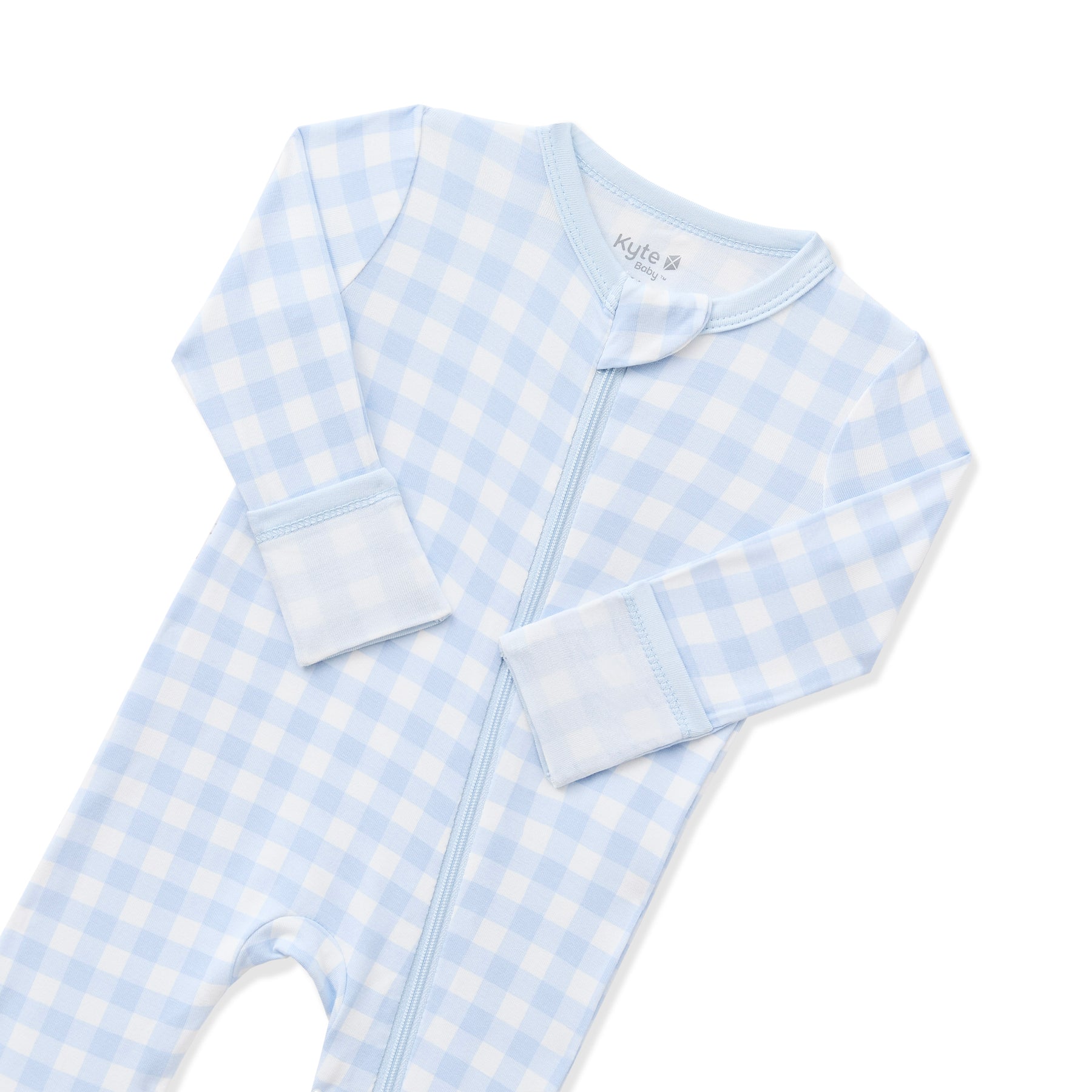 Close up of the zipper garage and fold over hand cuffs shown on the Zippered Romper in Gingham Breeze