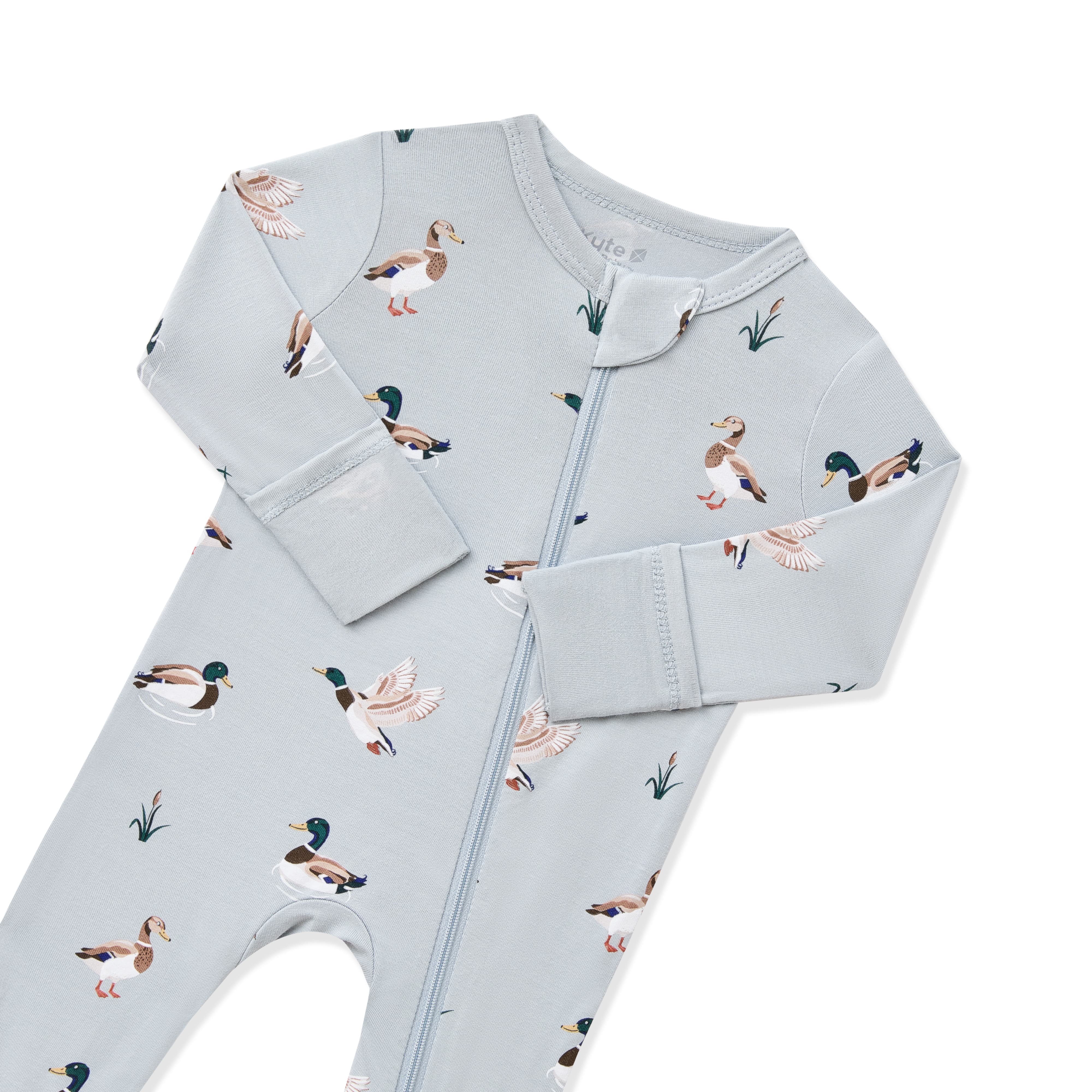 Close up of the zipper garage and fold over hand cuffs on the Zippered Romper in Mallard Duck