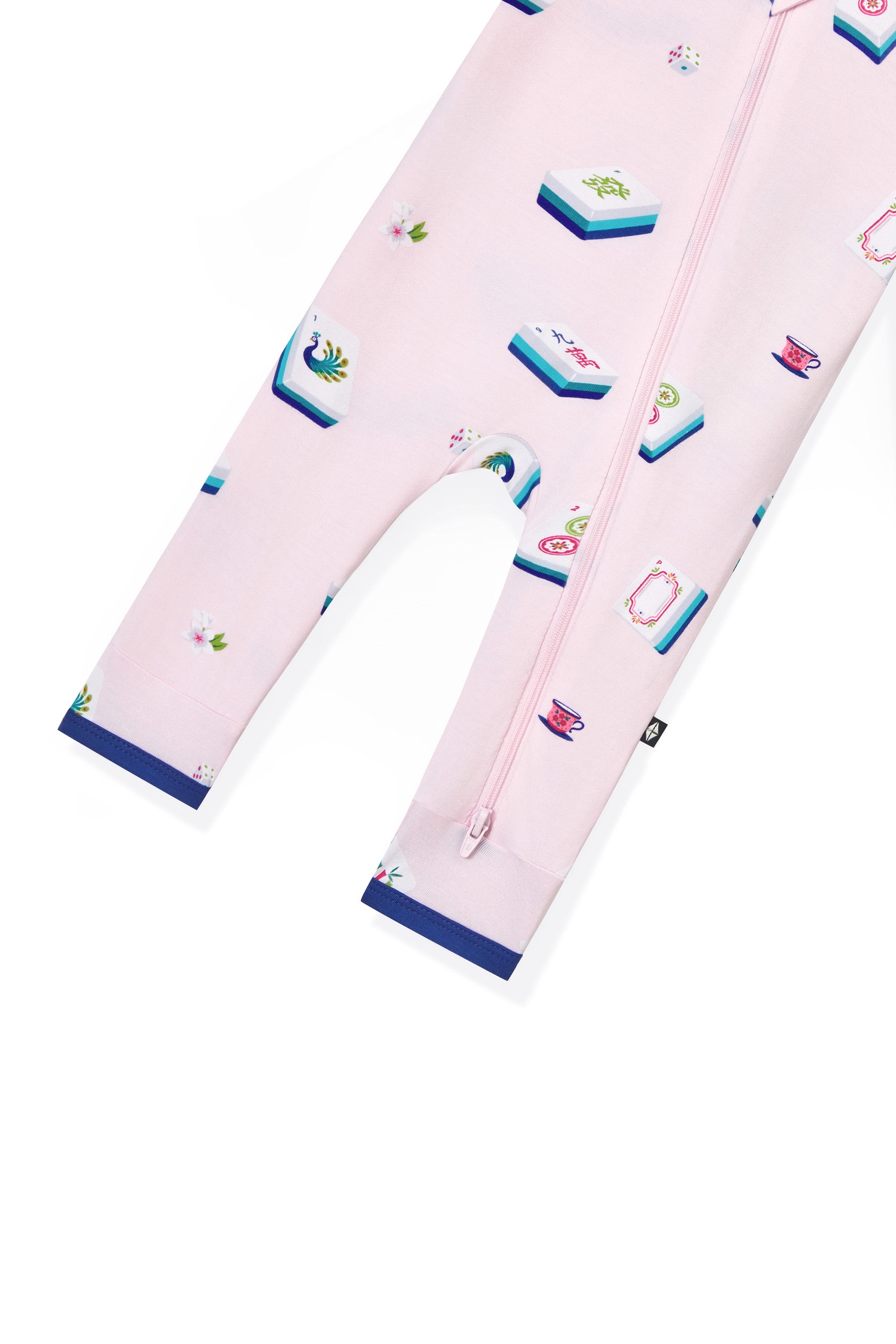 Bottom part of Pink Zippered Romper with Mahjong pattern on a white background