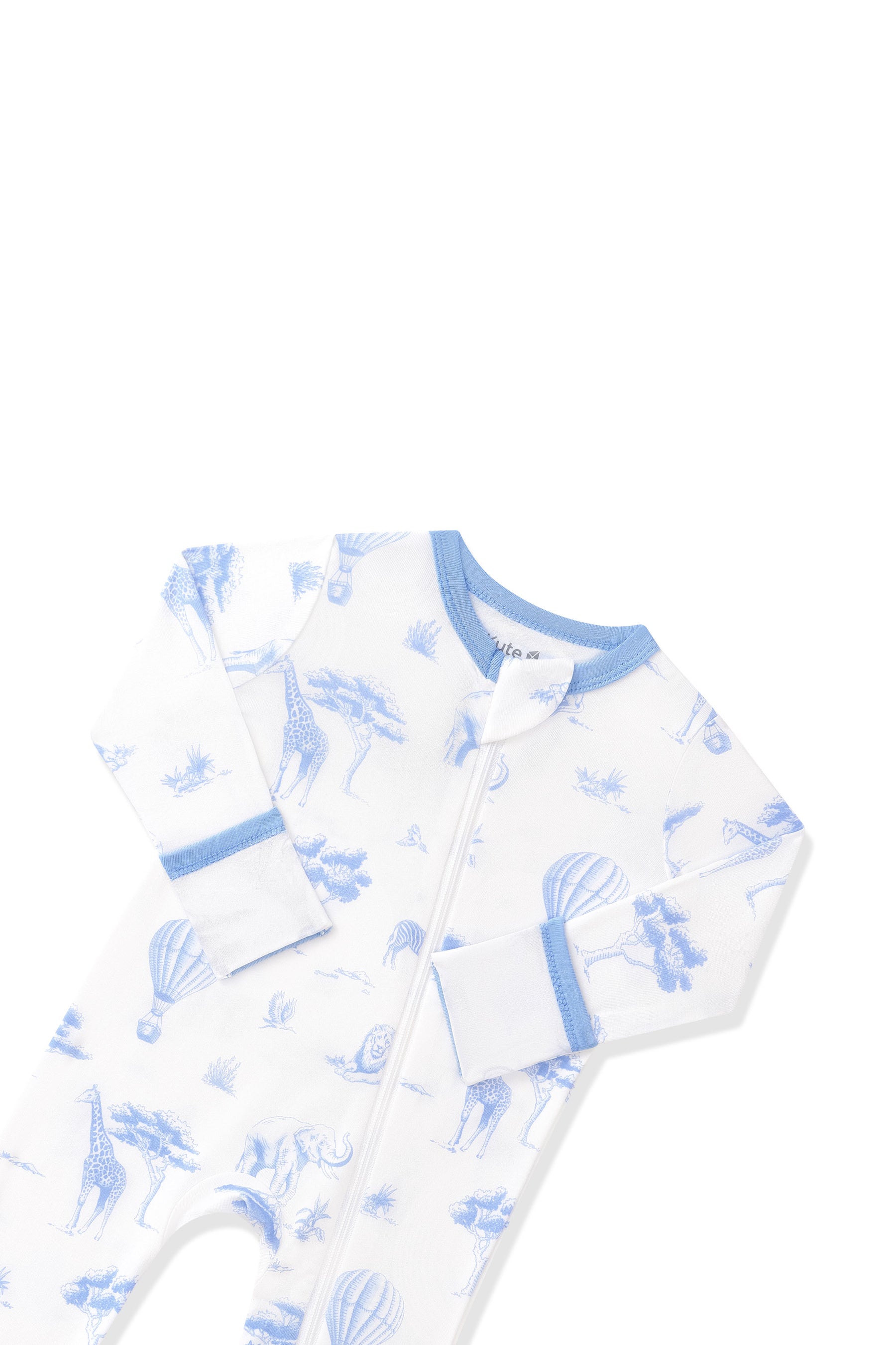 Close up of the zipper garage and fold over hand cuffs shown on the Zippered Romper in Toile Safari