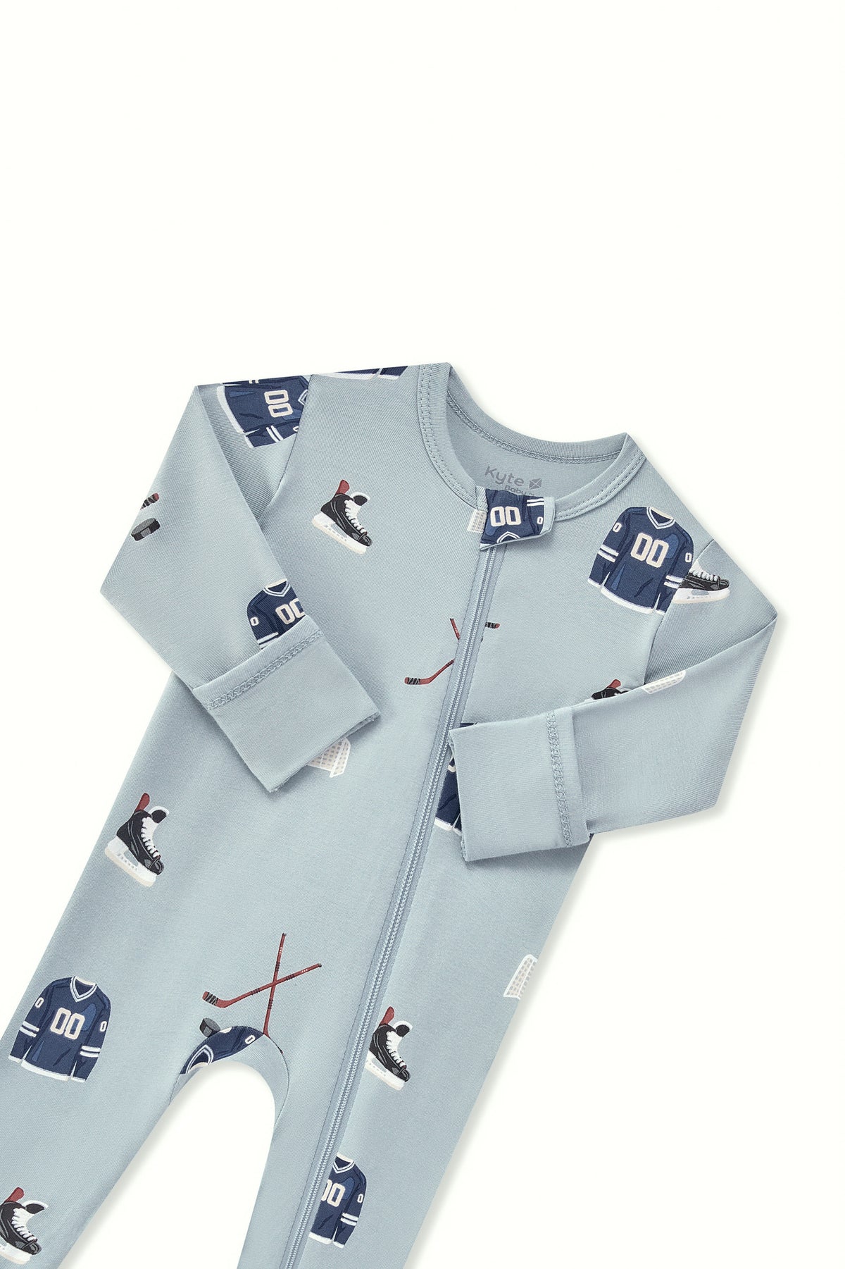 Zippered Romper in Vintage Hockey print with zipper garage on a white background