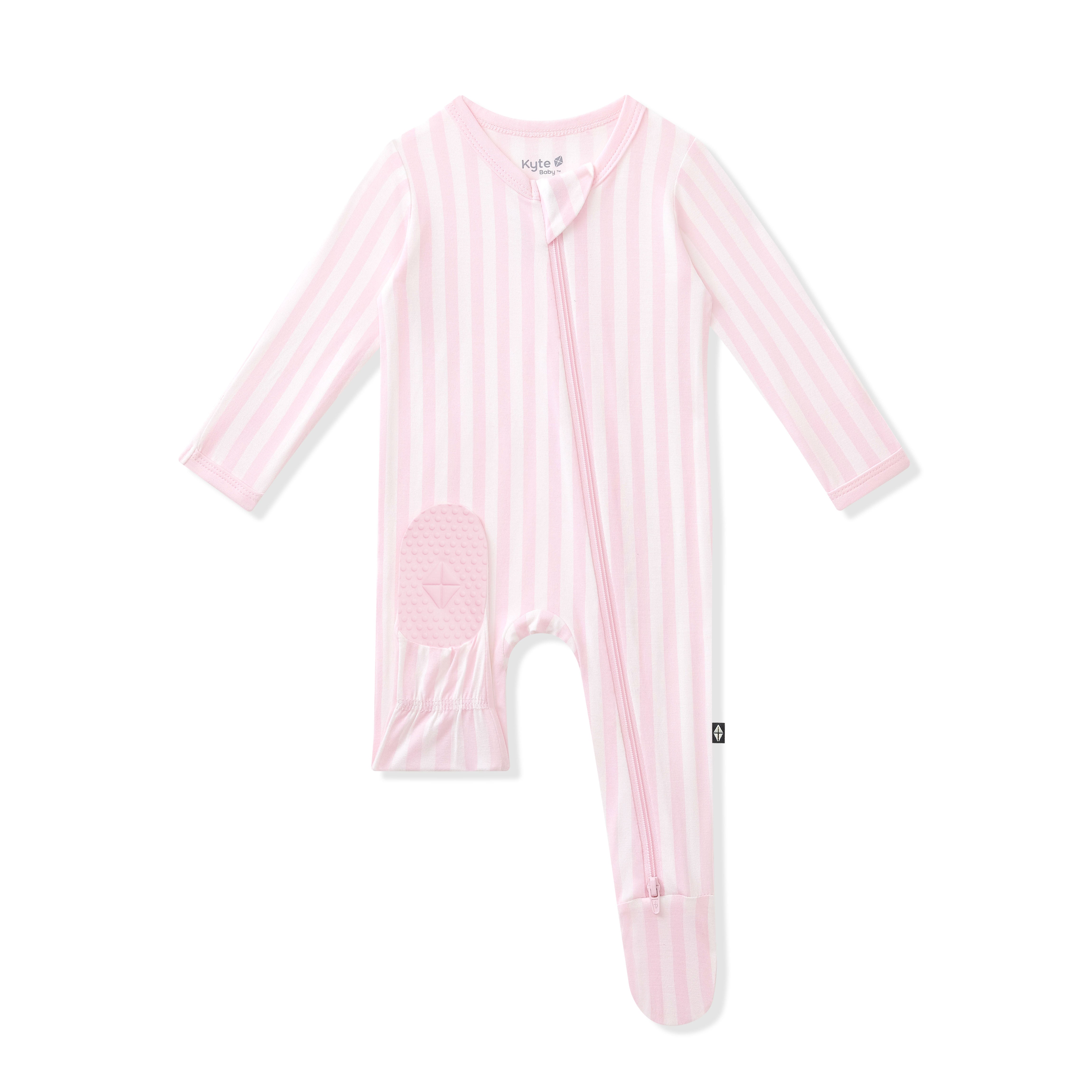 Product photo of the Zippered Footie in Small Sakura Stripe showing the kyte baby logo on the bottom of a foot pad 