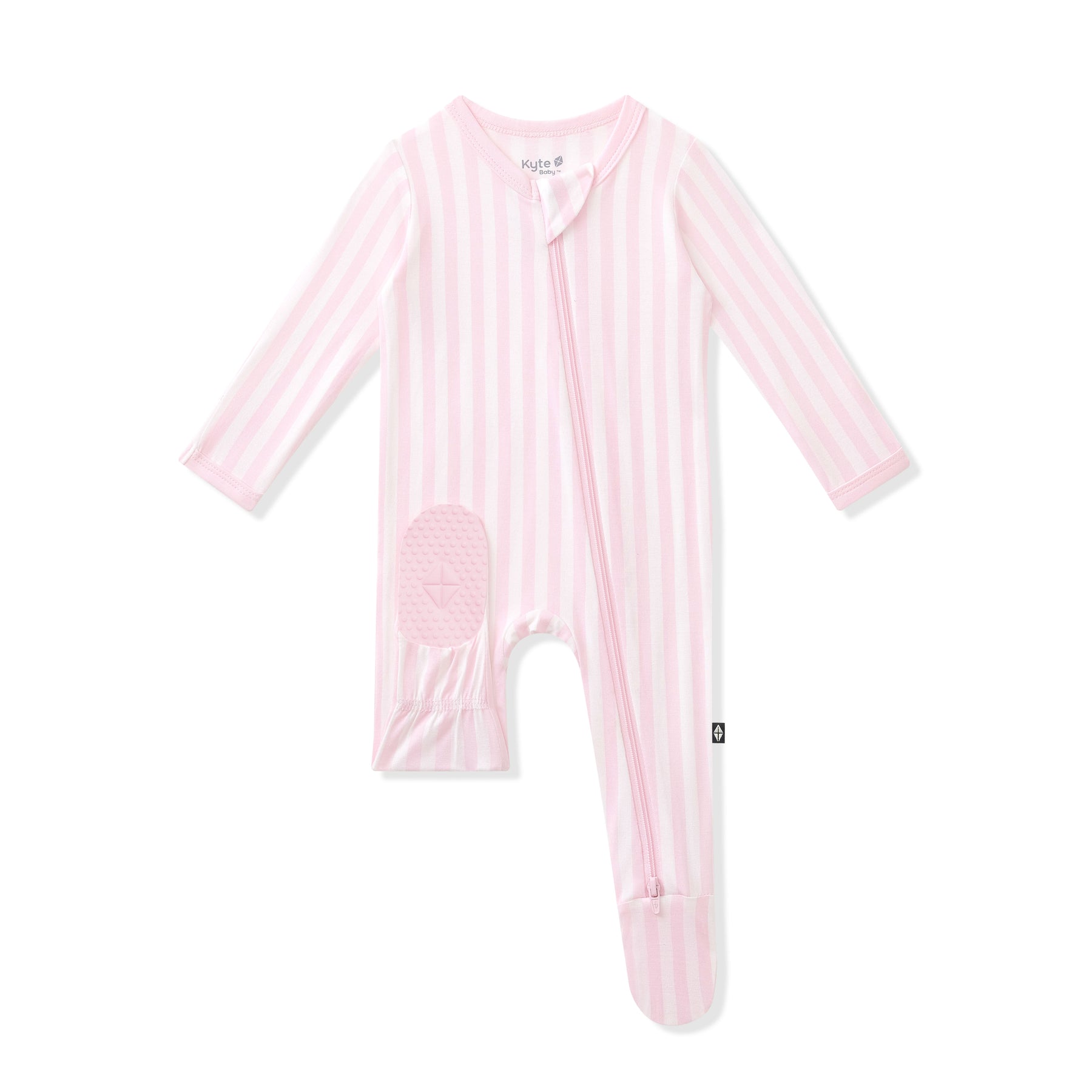 Product photo of the Zippered Footie in Small Sakura Stripe showing the kyte baby logo on the bottom of a foot pad 