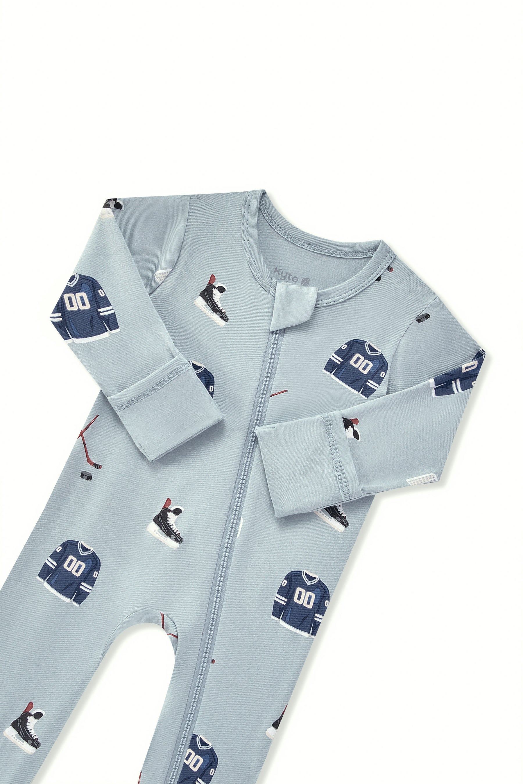 Zippered Footie in Vintage Hockey print with zipper garage on a white background