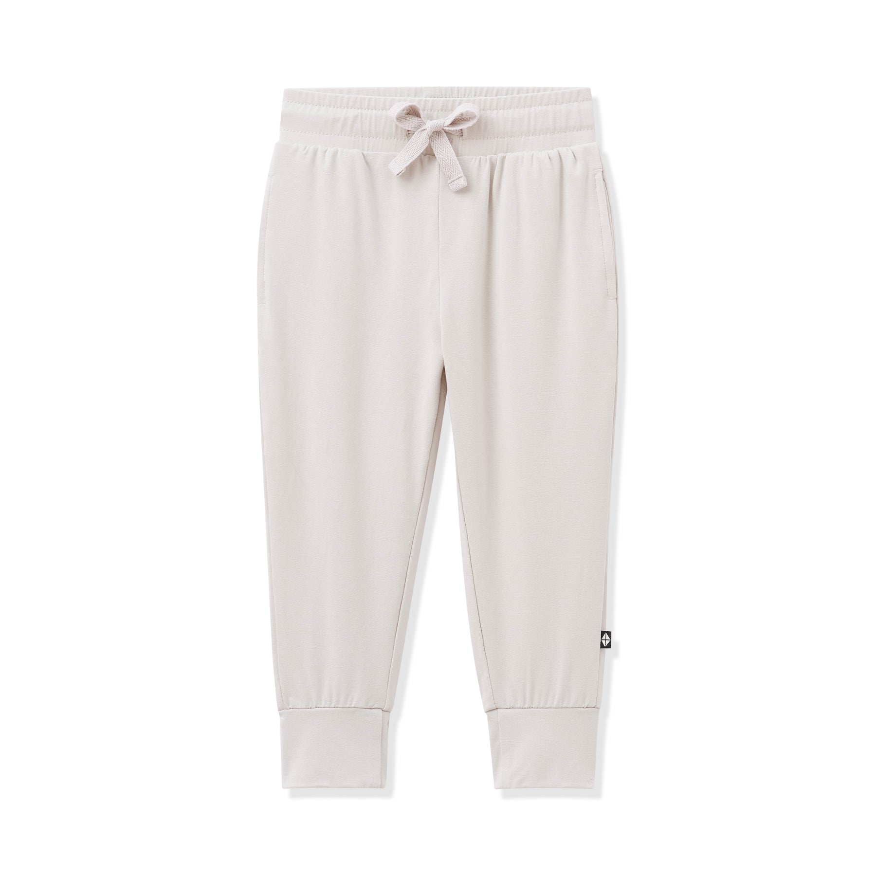 Beige sweatpants with a small logo on a white background