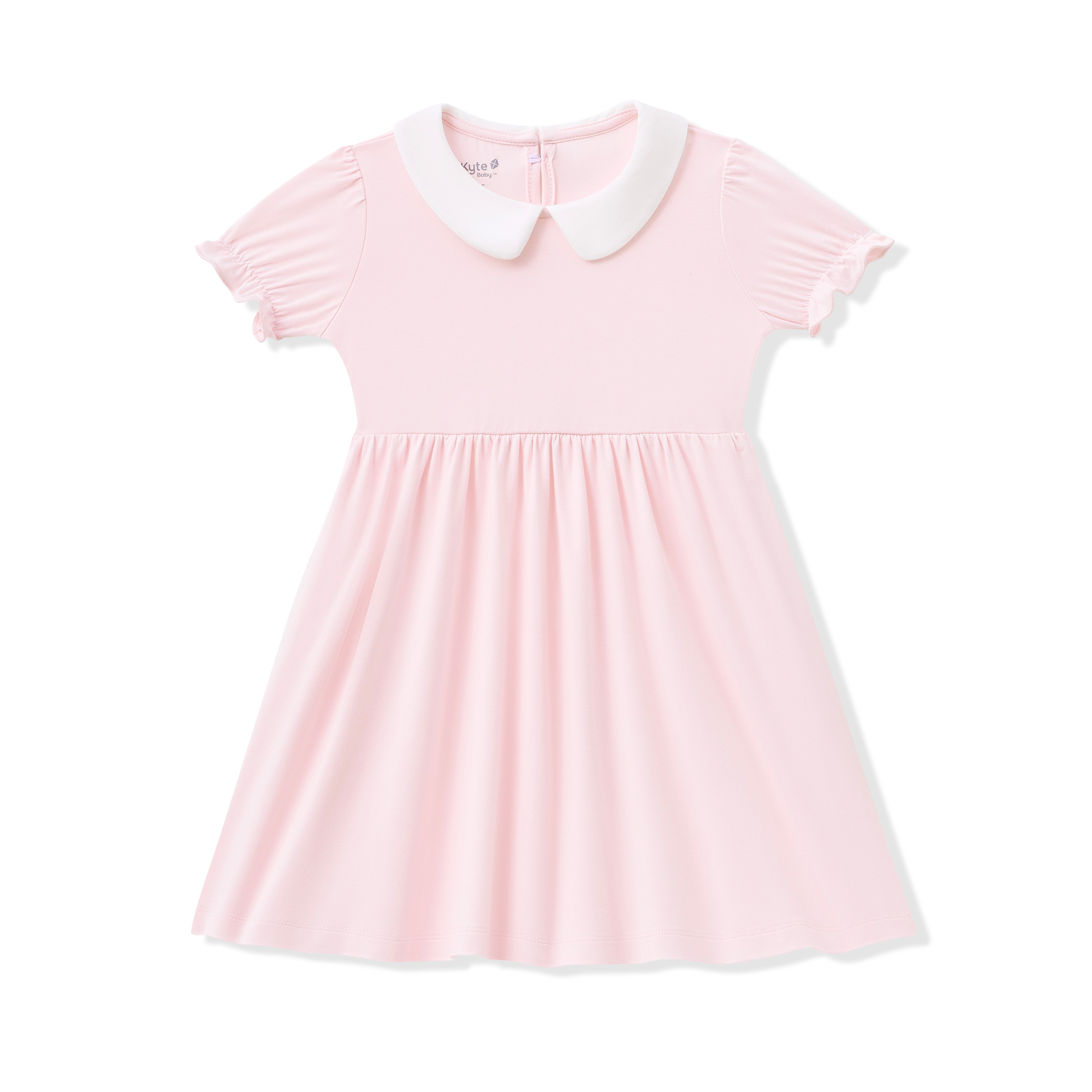 Pink dress with a white collar on a white background