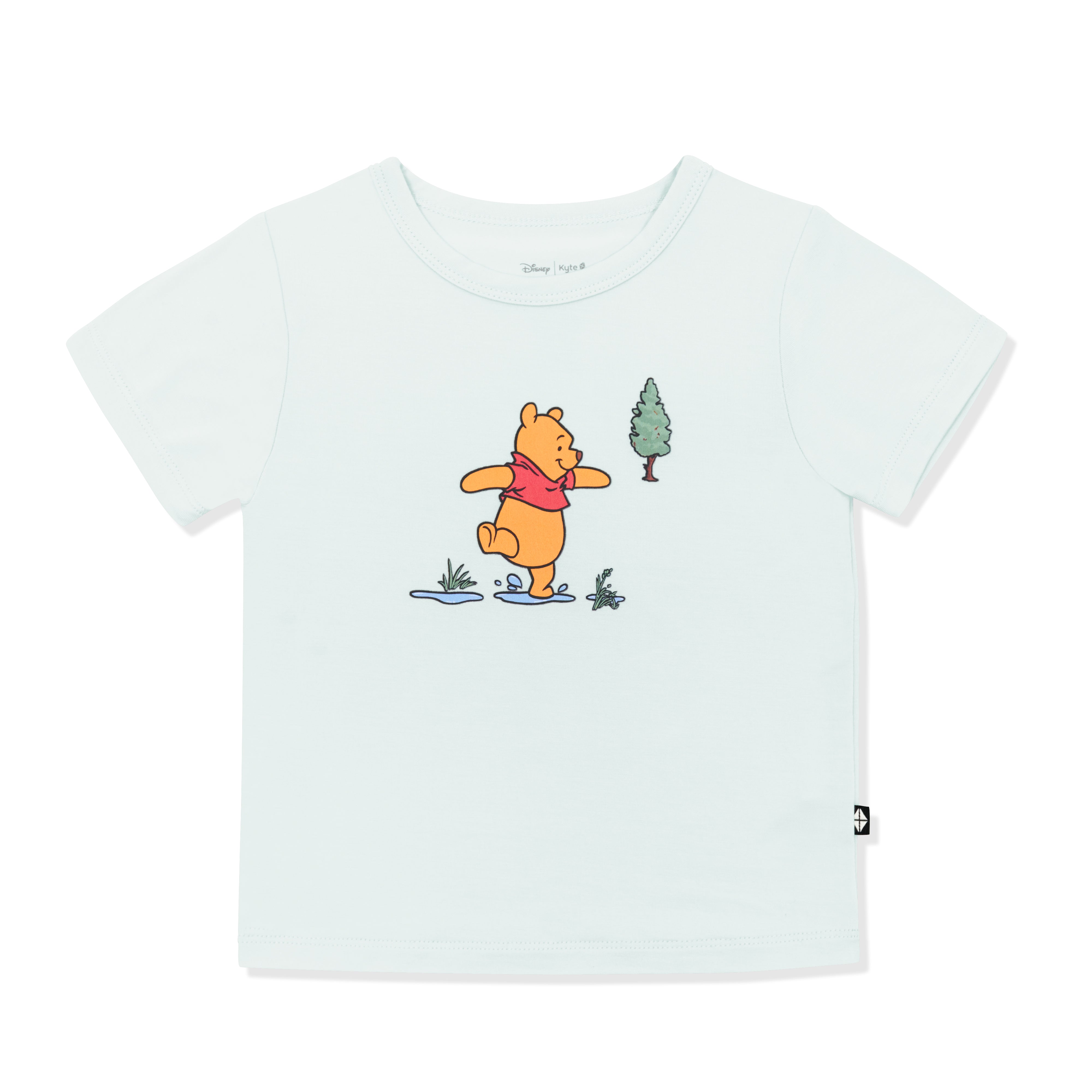 Light green basic tee with the graphic of winnie the pooh walking through puddles in the center of the shirt