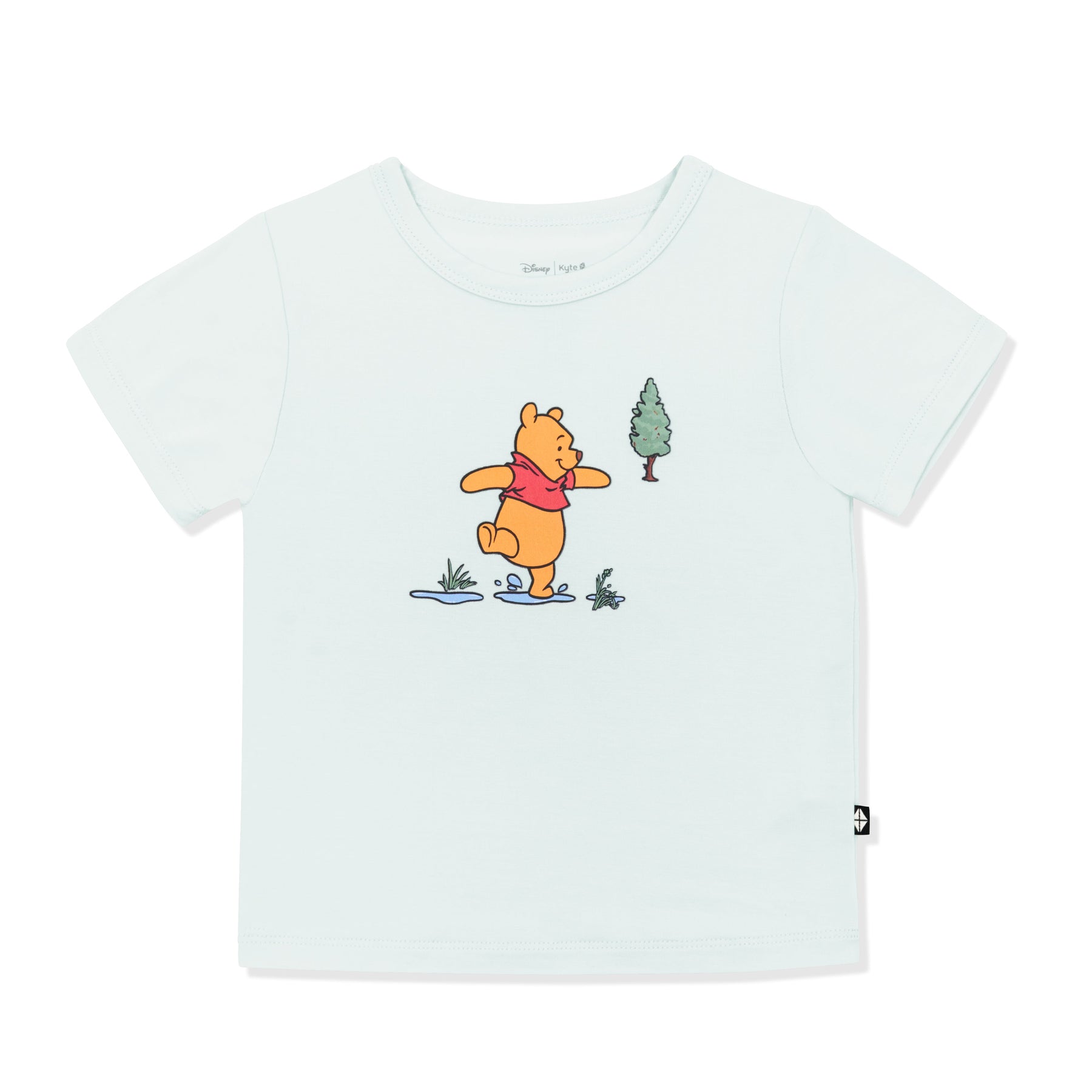 Light green basic tee with the graphic of winnie the pooh walking through puddles in the center of the shirt