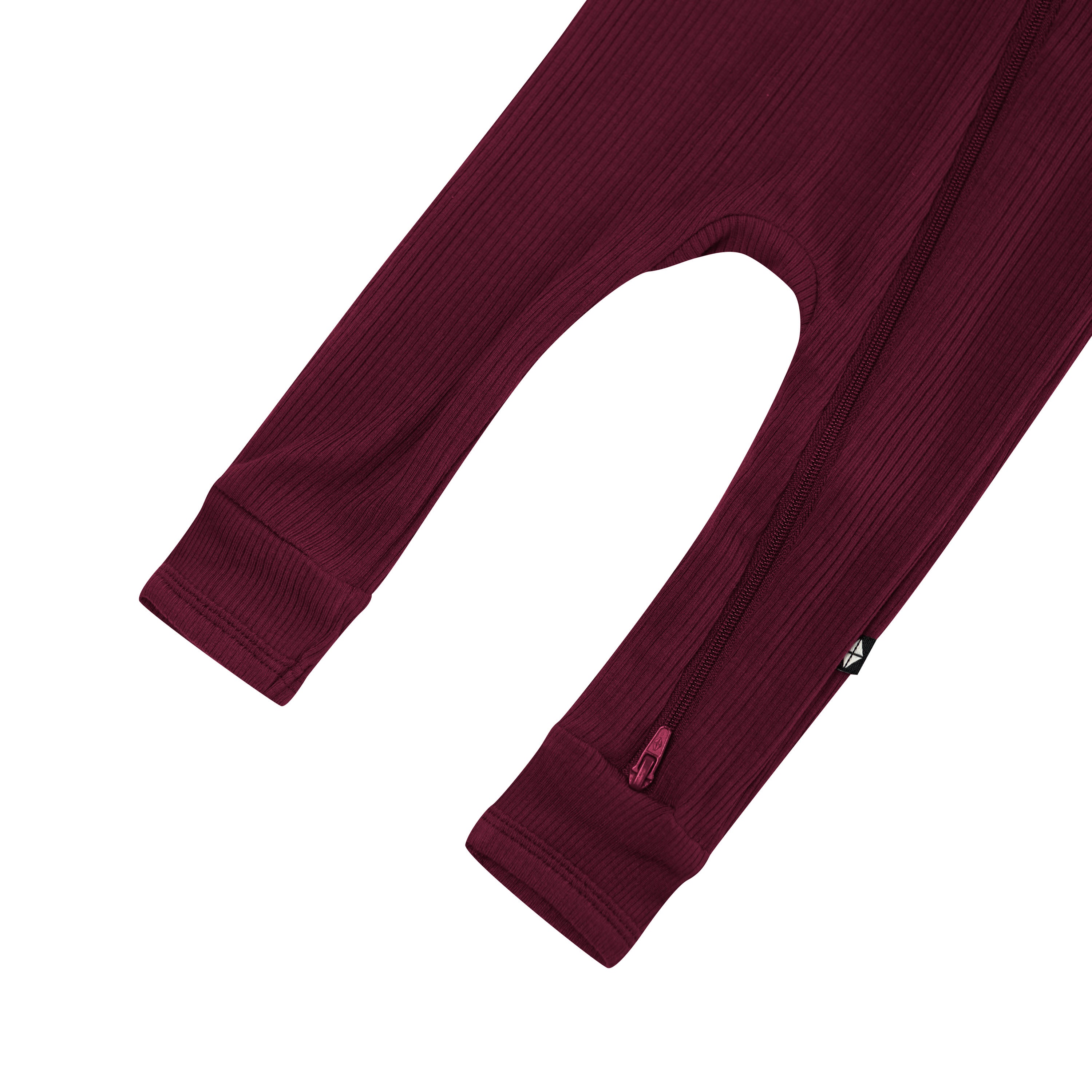 Zipper shown on the leg of the Ribbed Zipper Romper in Burgundy