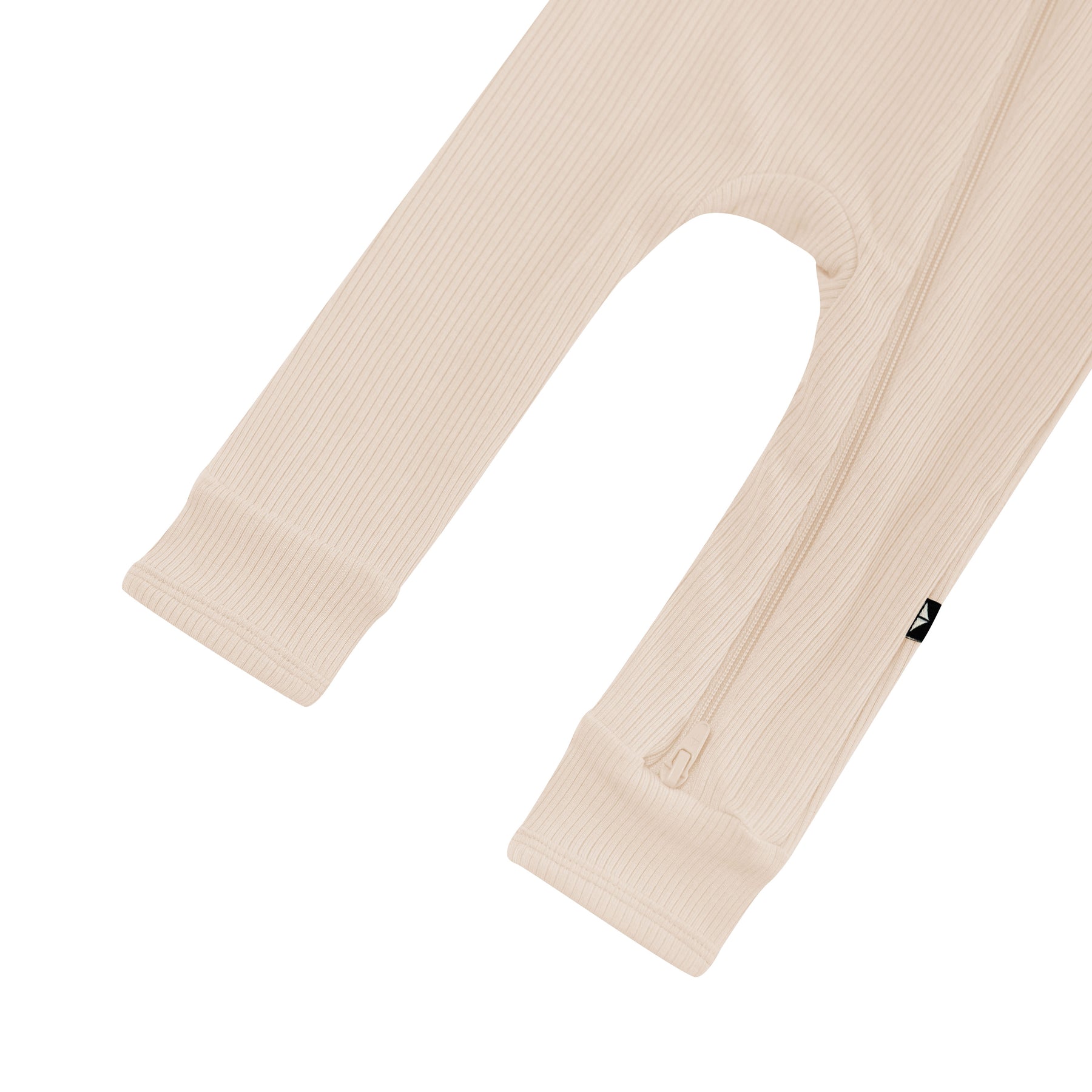 Zipper shown on the leg of the Ribbed Zipper Romper in Bisque