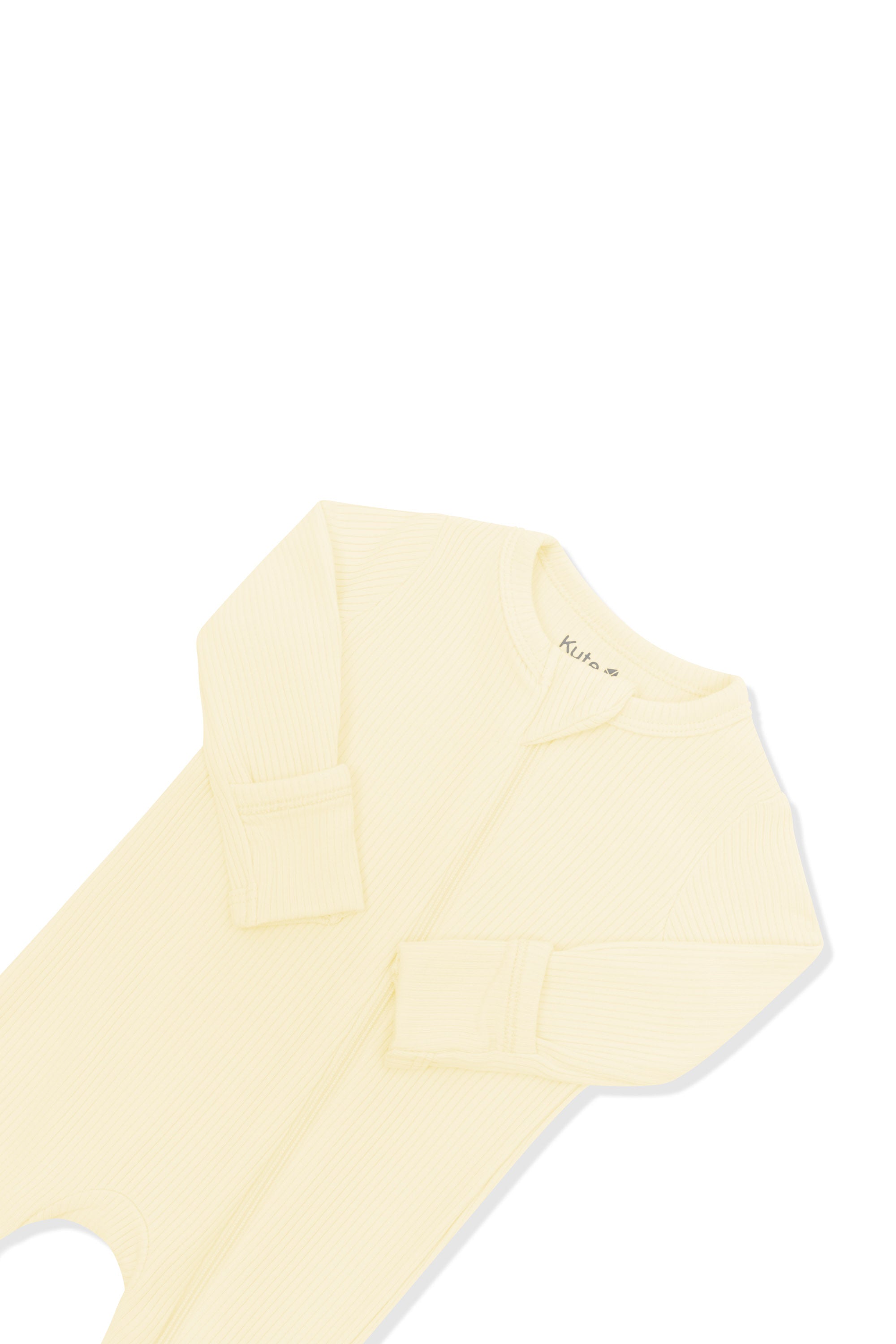 Close up of the zipper garage and fold over hand cuffs on the Ribbed Zipper Romper in Chamomile