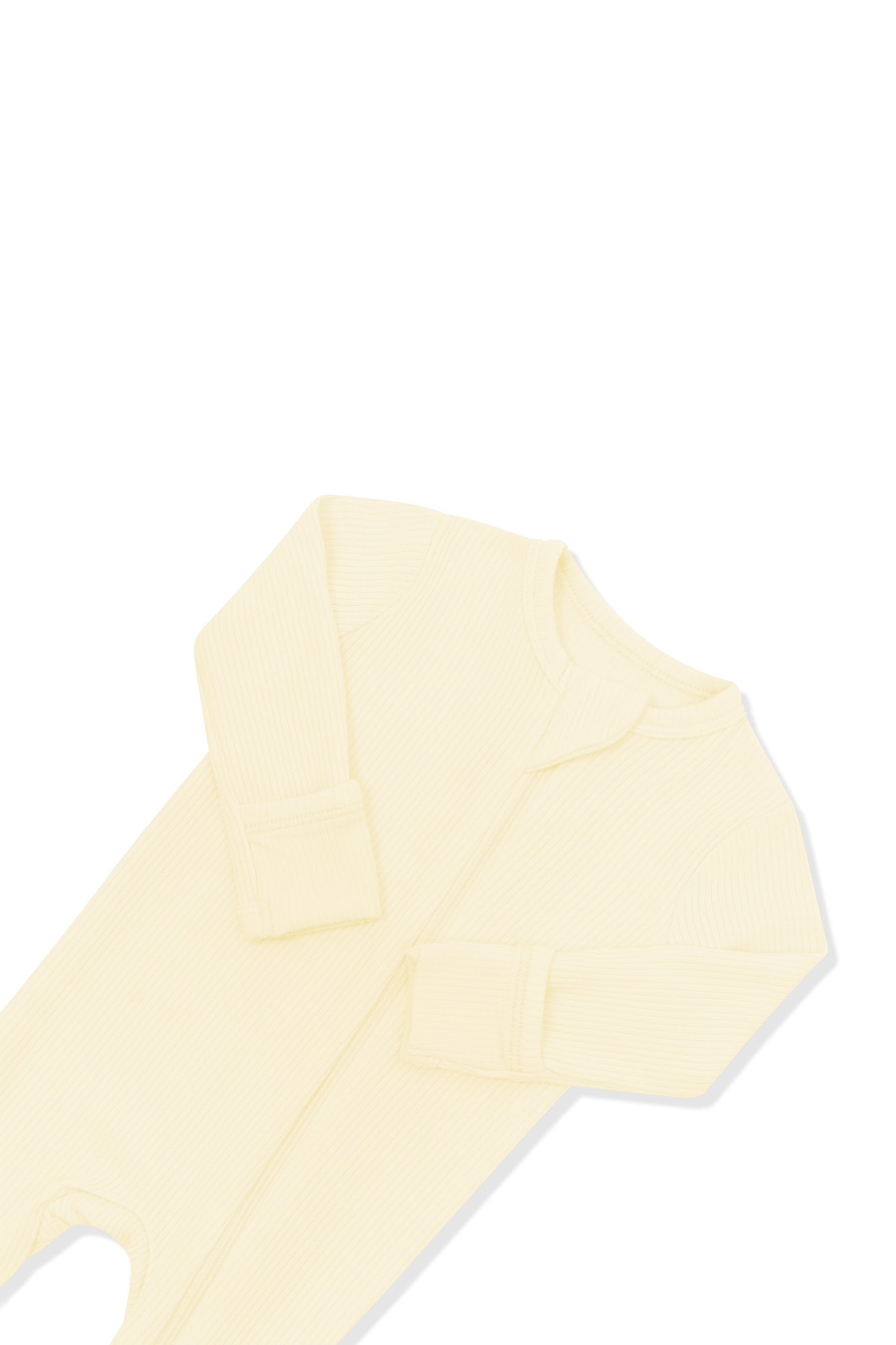 Close up of the zipper garage and fold over hand cuffs shown on the Ribbed Zipper Footie in Chamomile