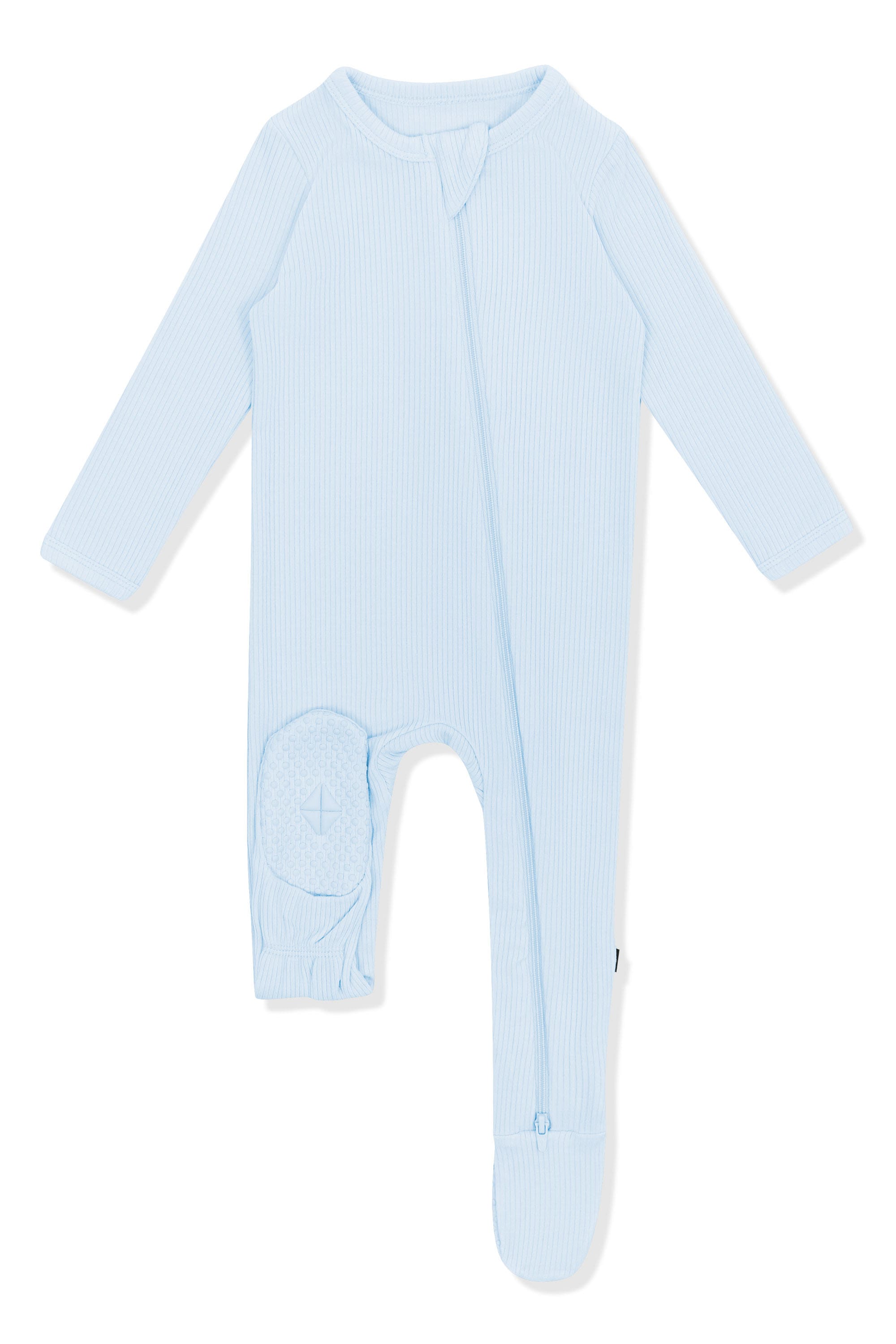 The bottom of the foot pad on the Ribbed Zipper Footie in Breeze