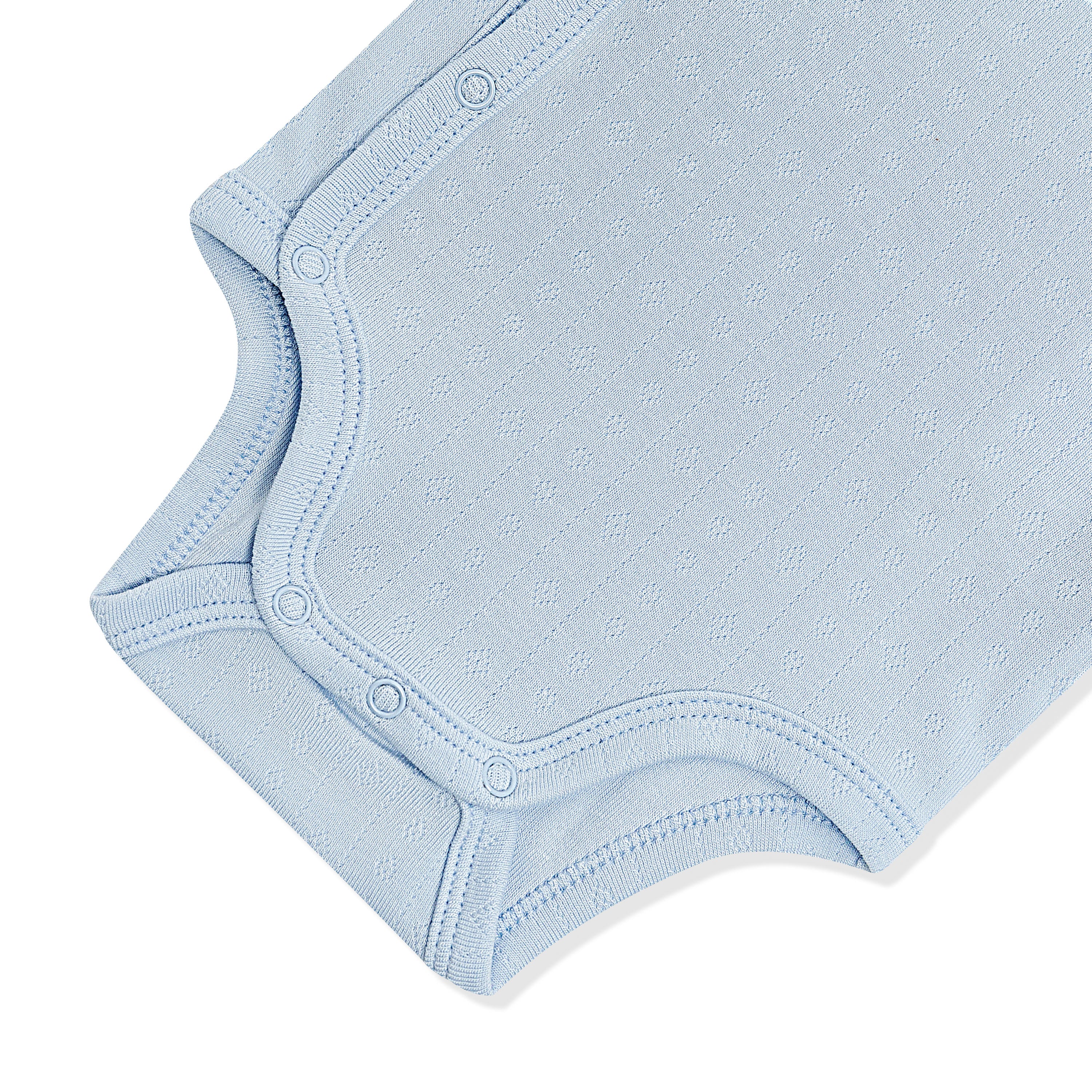 Close up of the inseam snap closure on the Pointelle Kimono Bodysuit in Breeze