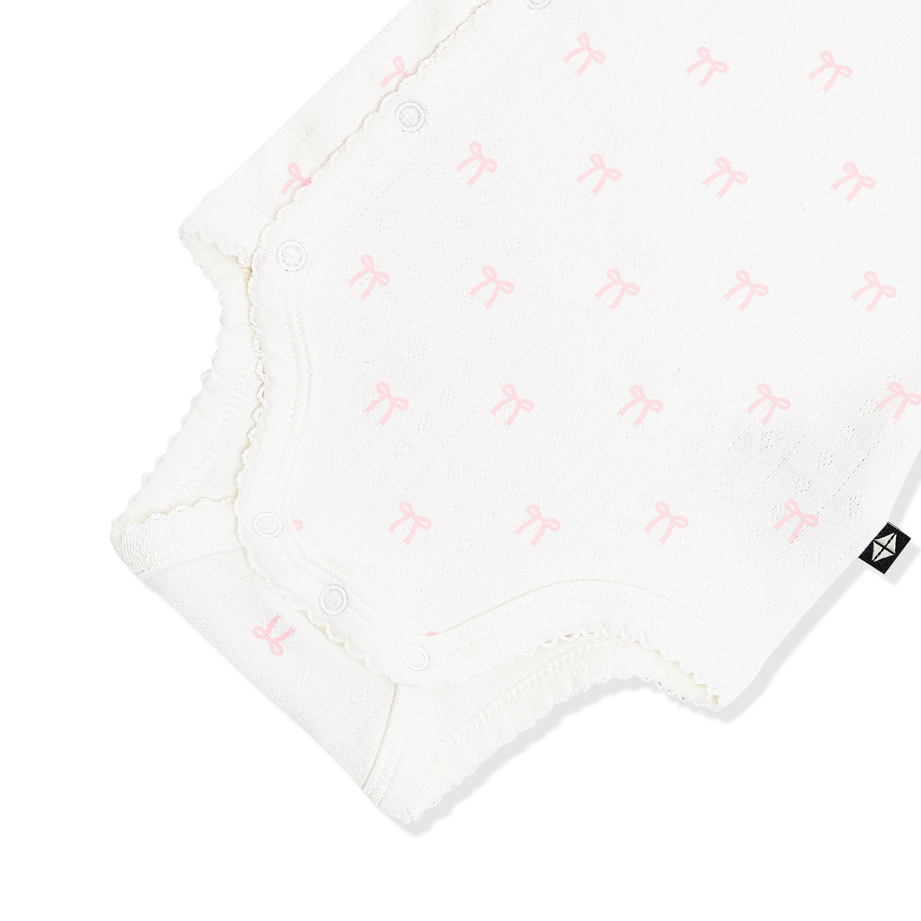 Close up of the picot trim and snap closure on the inseam shown on the Pointelle Kimono Bodysuit in Sweet Pink Bow