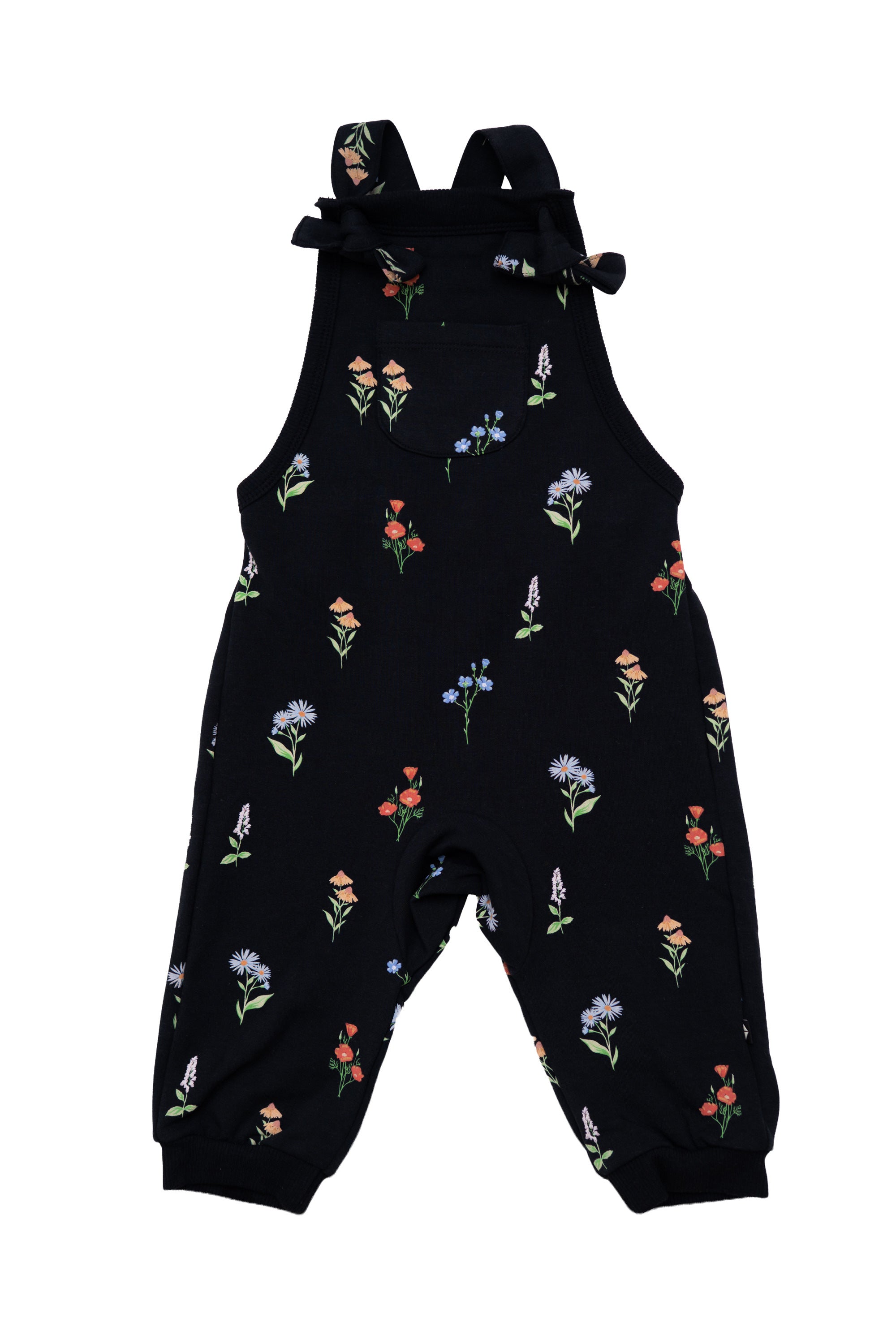 Black baby overall jumpsuit with an all-over colorful wildflower print, featuring adjustable shoulder ties and elastic cuffed ankles, shown on a plain white background.