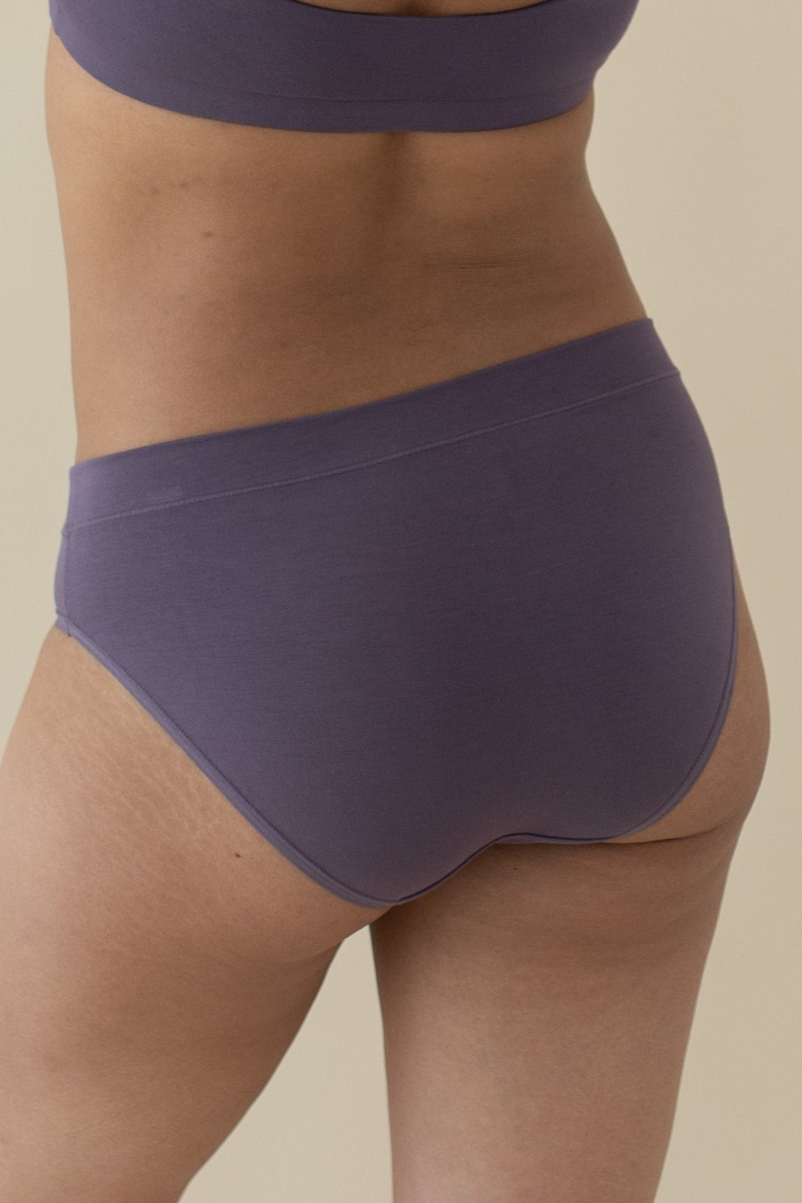 The back of the Women's Midi Brief in Currant shown on a female model